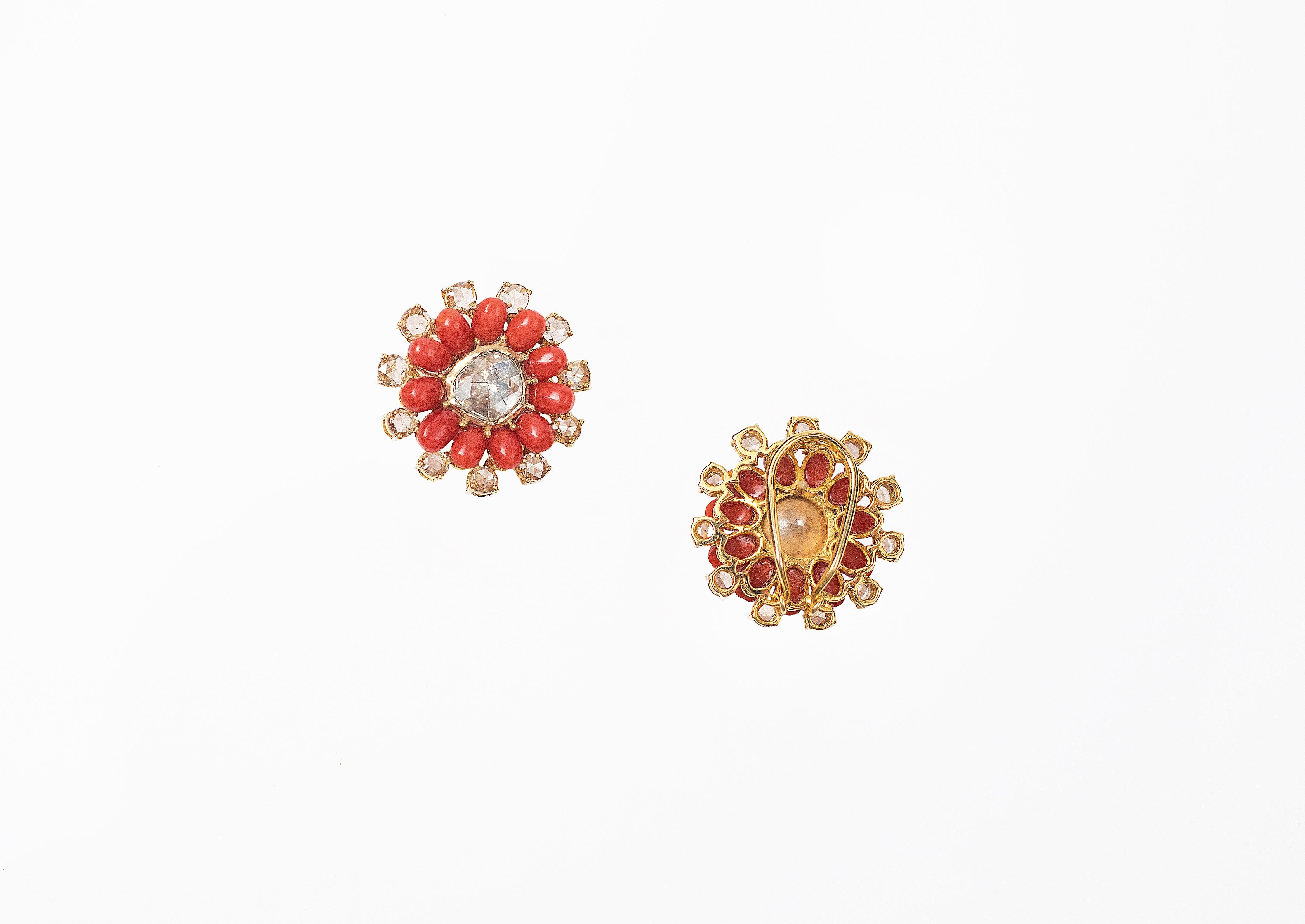 Handcrafted Stud Earrings in 14k Yellow Gold Studded with Flat Cut Diamond, Rose Cut Diamond and Corals.
Gold Weight - 13.920 gms
Colour - Yellow
Diamond Clarity - VS
Colour - G and Yellow
Diamond Shape - Flat Cut and Rose Cut
Stone - Coral
Shape-
