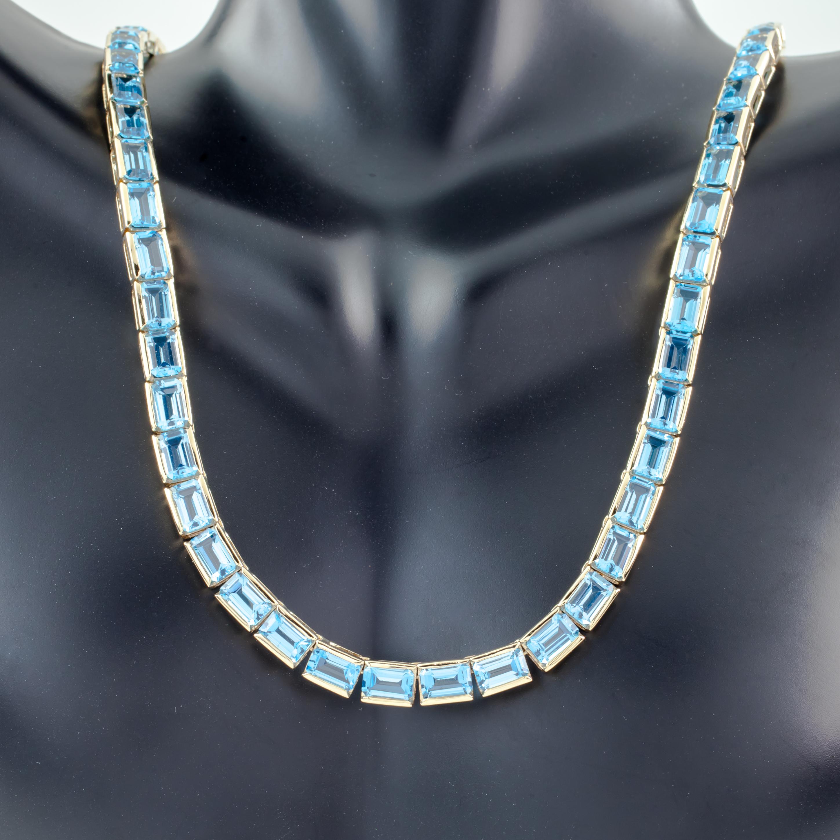 Beautiful Blue Topaz Tennis Necklace
64 0.50 carat Blue Topaz Stones Set in 14k Yellow Gold.
Total Carat Weight: 32.00 carats
Total Length = 16
