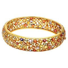 32.00 Carat Oval Shape Sapphire 14 Karat Yellow Gold Bangle Bracelet