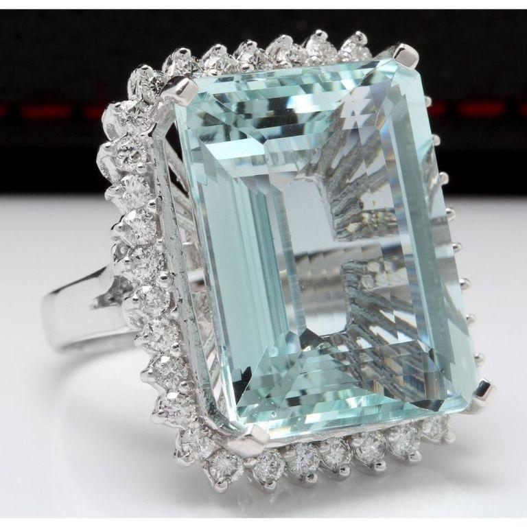 32.00 Carats Natural Aquamarine and Diamond 14K Solid White Gold Ring

Total Natural Emerald Cut Aquamarine Weights: 30.25 Carats

Aquamarine Measures: 20.80 x 15.60mm

Natural Round Diamonds Weight: 1.75 Carats (color G / Clarity VS2-SI1)

Ring