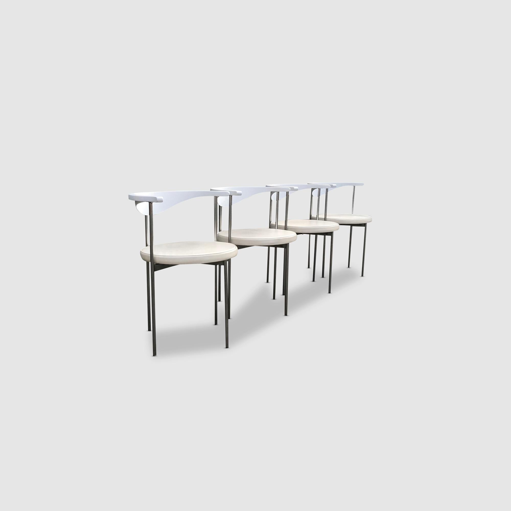 An elegant set of 4 model 3200 dining chairs by Frederik Sieck.

This design certainly has its roots in Japanese design by the curved shape of the backrest and the slim narrow feet.The round upholstered seat certainly enforces this further. As well,