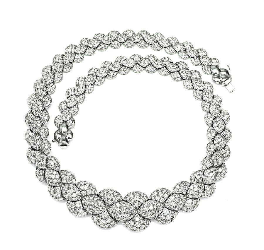 This is a gorgeous platinum necklace. The necklace is set with sparkling round cut diamonds that weigh approximately 32.00ct. The color of the diamonds is G-I with VS-SI clarity. The necklace has a tapering width from 10.5mm to 20.5mm. The necklace