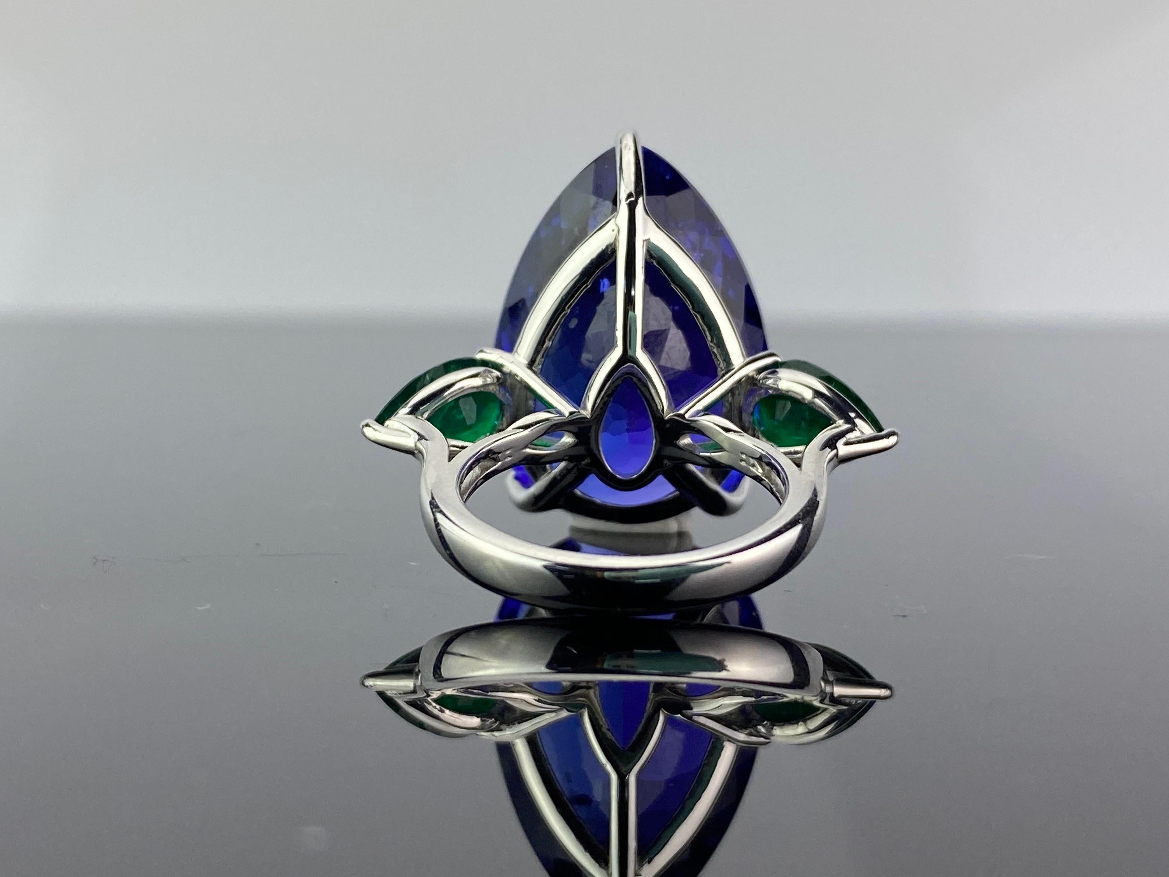 Modern 32.05 Carat Pear Shape Tanzanite and Emerald Three-Stone Cocktail Ring For Sale
