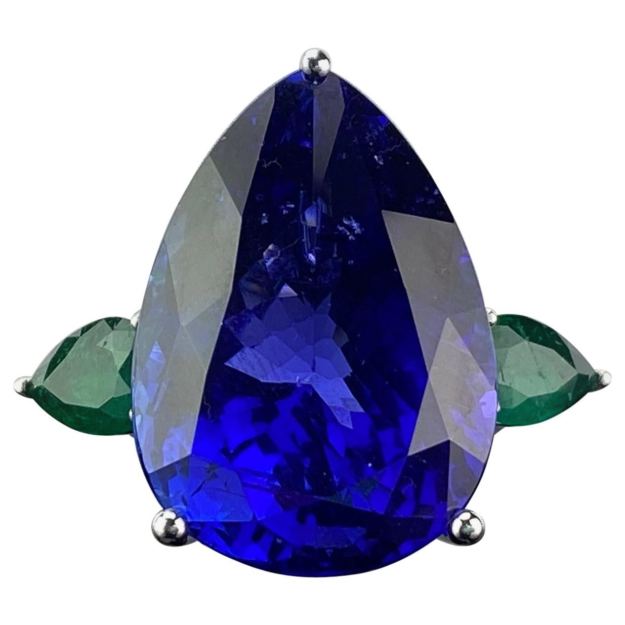 32.05 Carat Pear Shape Tanzanite and Emerald Three-Stone Cocktail Ring For Sale