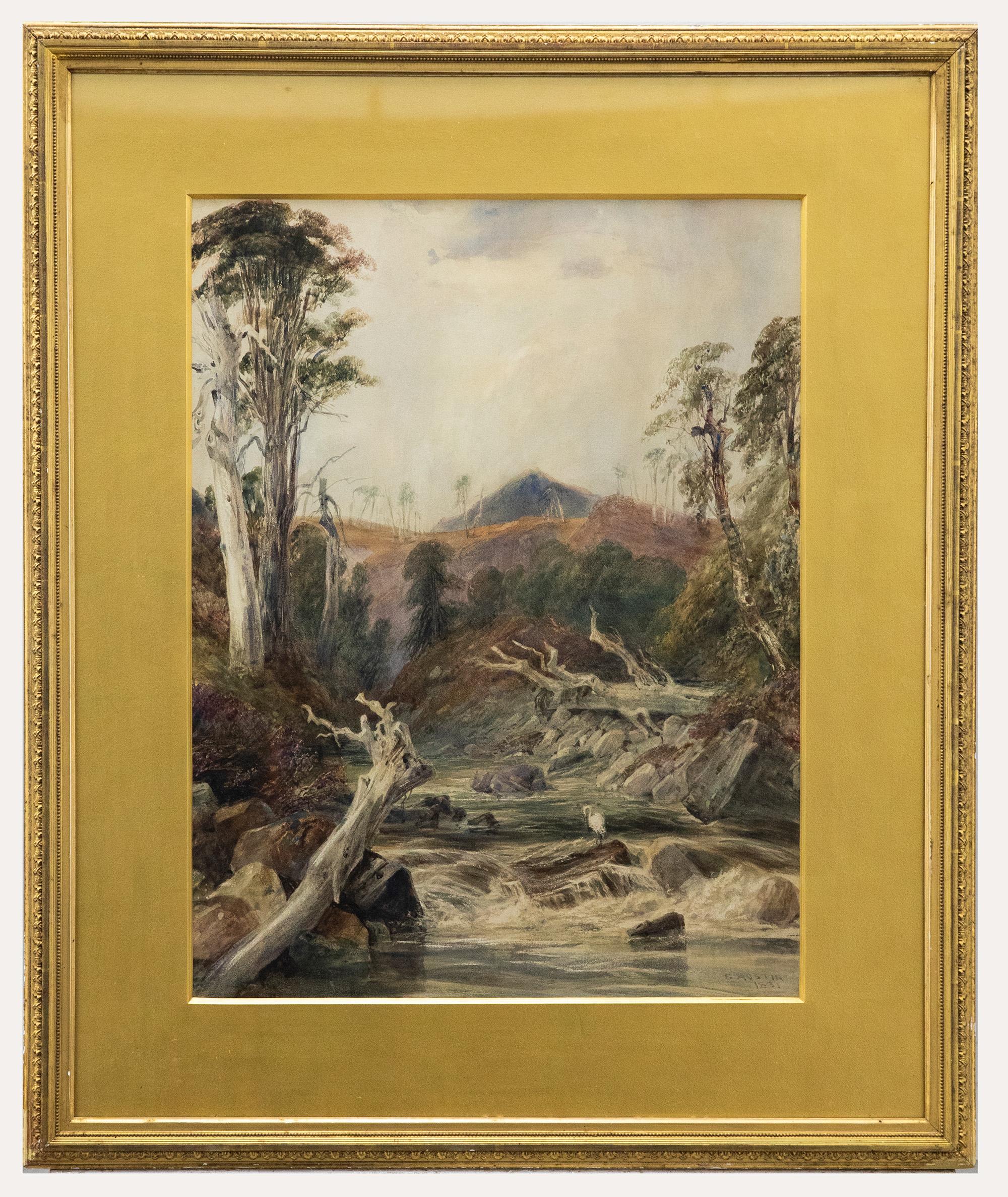 A charming watercolour scene depicting a river flowing between banks with fallen trees. Perched on a rock in the center of the river a heron looks for fish in the stream. Signed and dated to the lower right. Presented in a gilt frame and gold card