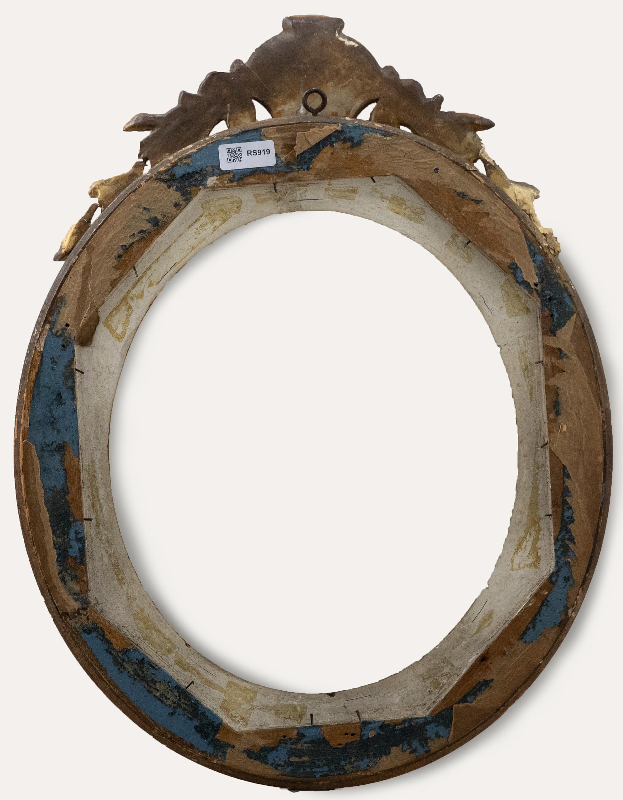 A wonderful 19th century gilt oval picture frame in the French Rococo style, elaborately decorated with foliate running patterns and elaborate upper gesso shell and acanthus ornamentation.Measurements for the frame are: Window (39 x 33.5cm); Rebate
