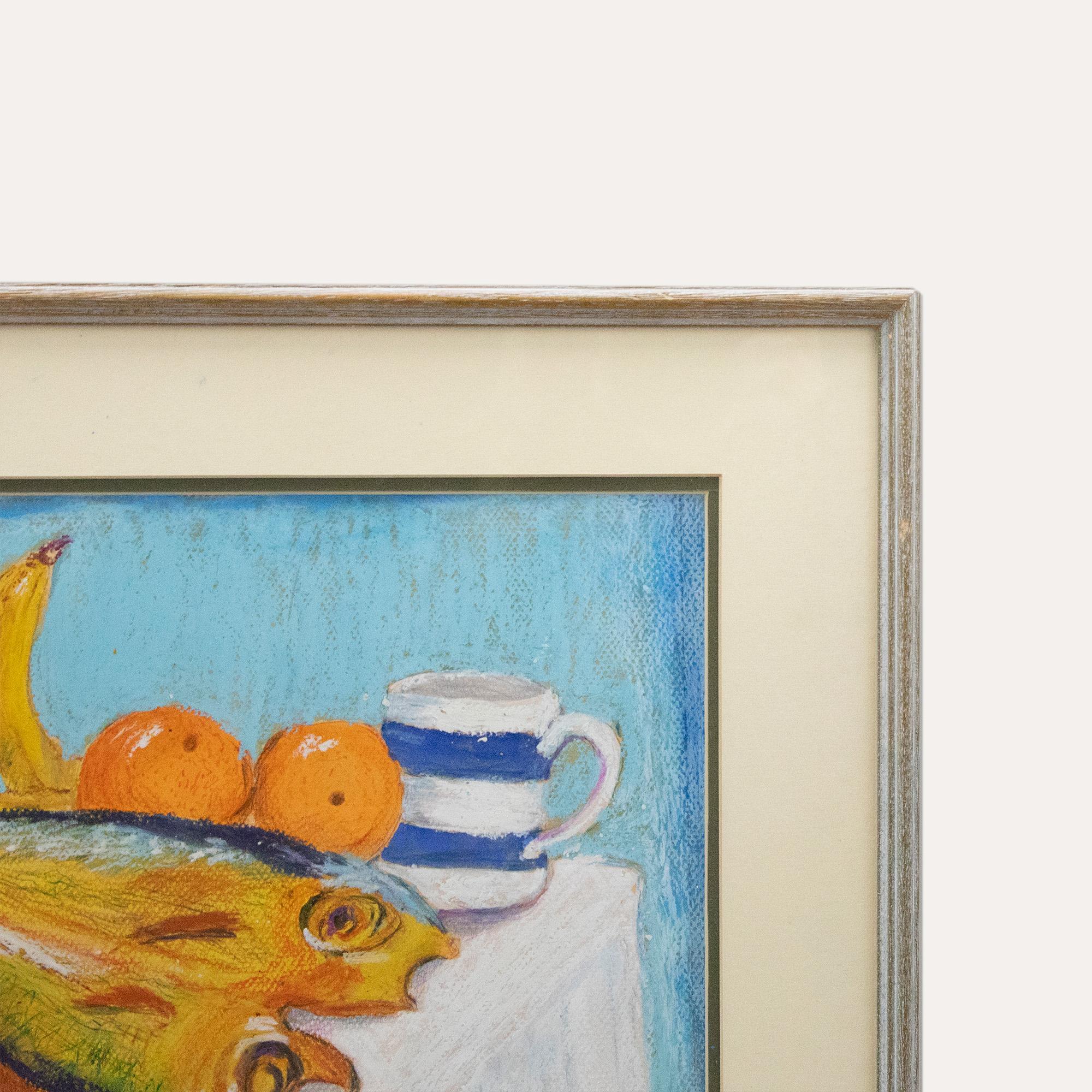 A charming pastel scene depicting two dead fish placed with banana, oranges and a striped mug. The artist captures the composition in a vibrant colour palette creating a fun and lighthearted still life study. Signed and dated to the lower right.