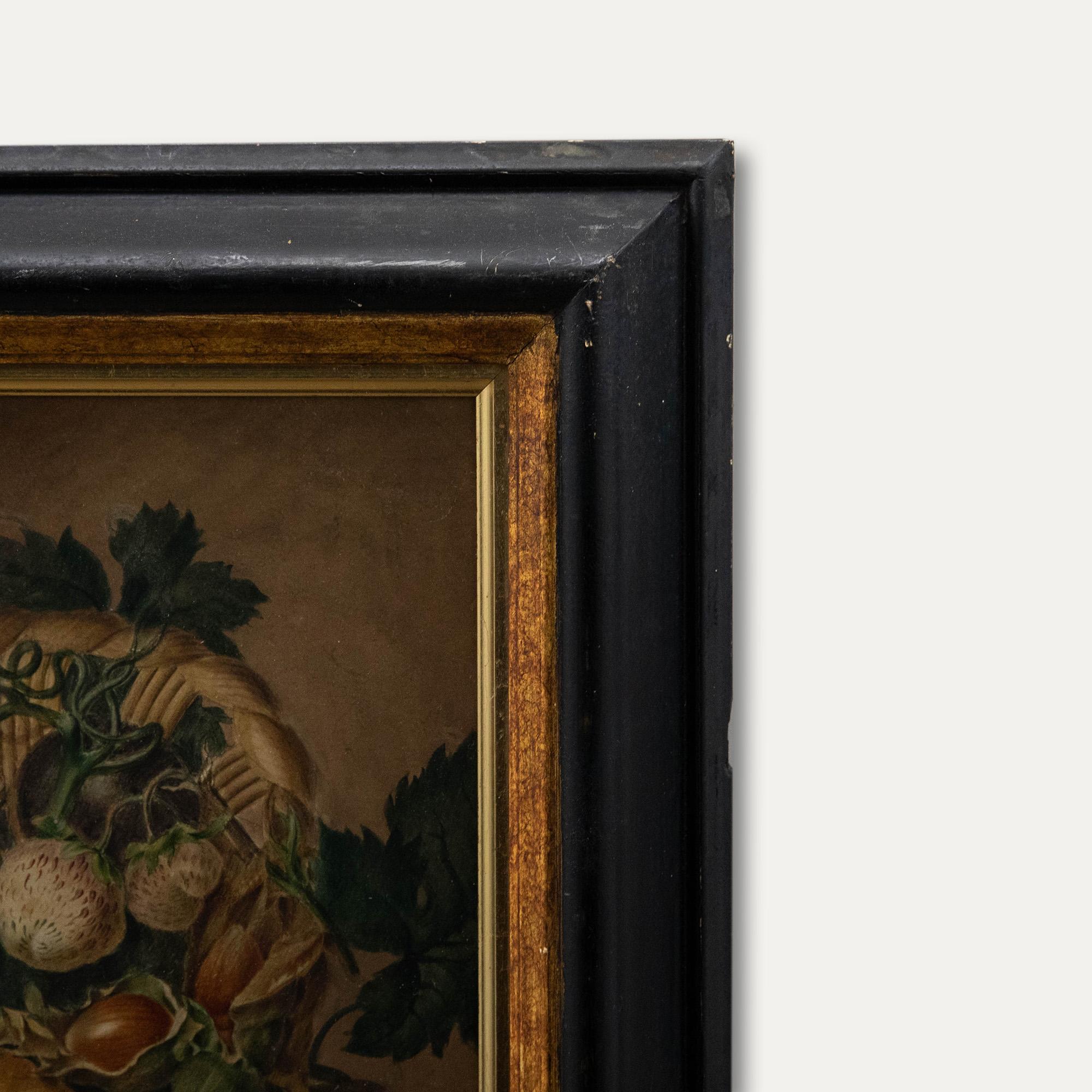 Une belle nature morte de la fin du 19e siècle montrant une délicate gamme de fruits et de noix tombant d'un panier en osier. Les pommes, les prunes, les fraises, les cerises et les raisins sont mélangés aux noisettes, avec les tiges et le