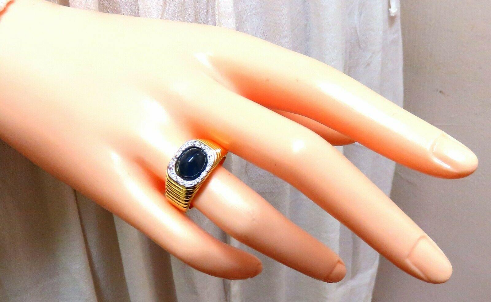 Vintage Cabochon Sapphire Diamonds Ring

3.00ct. Natural Blue Sapphire

9 X 6.5mm diameter

Midnight Blue Color

.20ct. Diamonds.

H-color Vs-2 clarity.

  14kt. yellow gold

12.1 grams

Ring Current size: 7.75

(Free Resize Service, Please