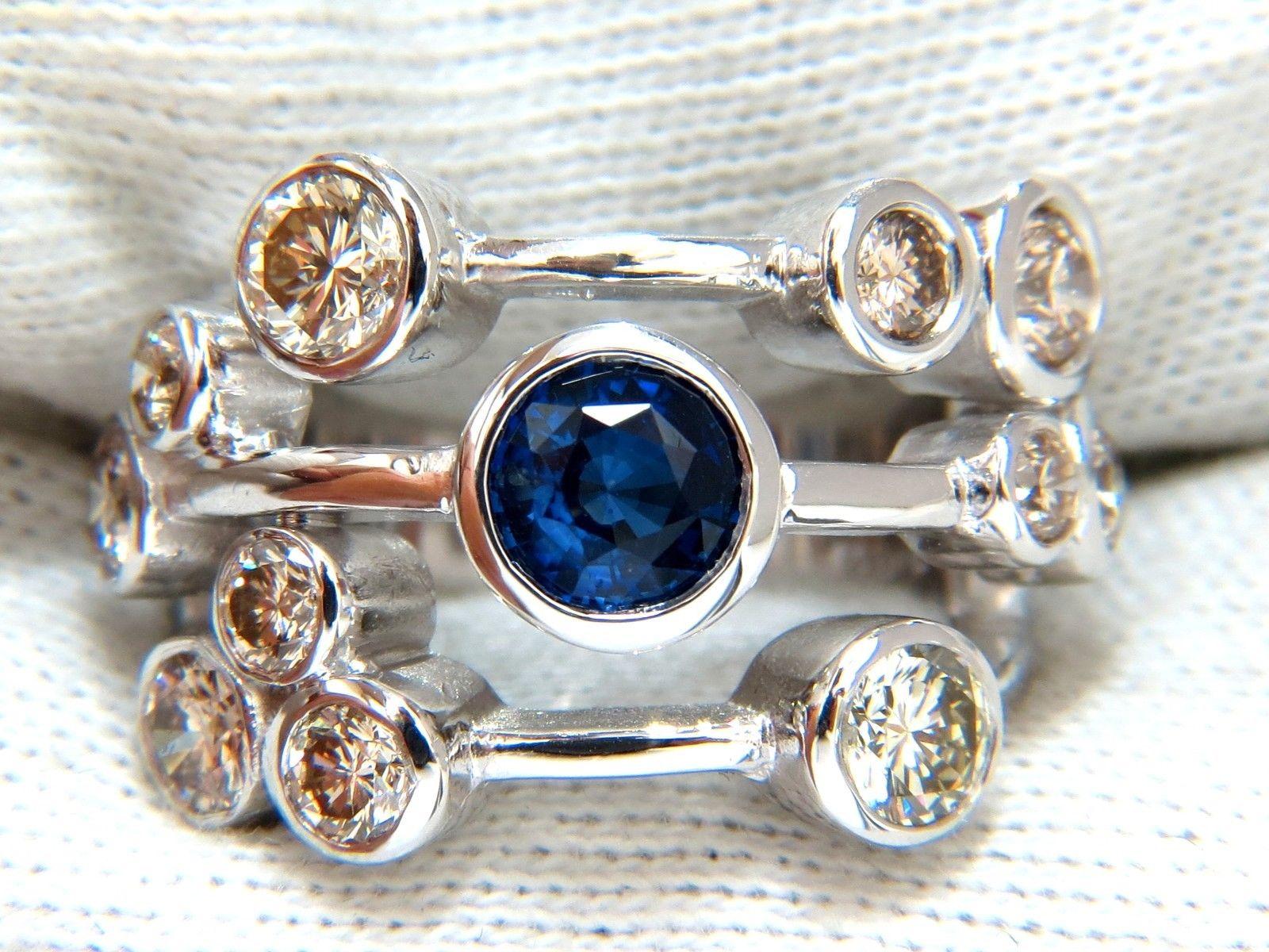 Three Rowed, Station Linked & Flush mounted

2.18ct. Natural Fancy color Light Brown Diamonds 

& 1.02 Natural Round Sapphire ring.

Full cut round brilliants Diamonds & Sapphire.

 vs-2 clarity.

Sapphire, Vivid Royal Blue & Clean Clarity.

  14kt.