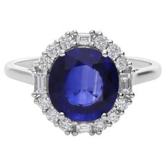 Anello di fidanzamento aureolato con diamante da 3,20 carati e zaffiro blu rotondo da 0,38 carati in oro bianco 14 carati