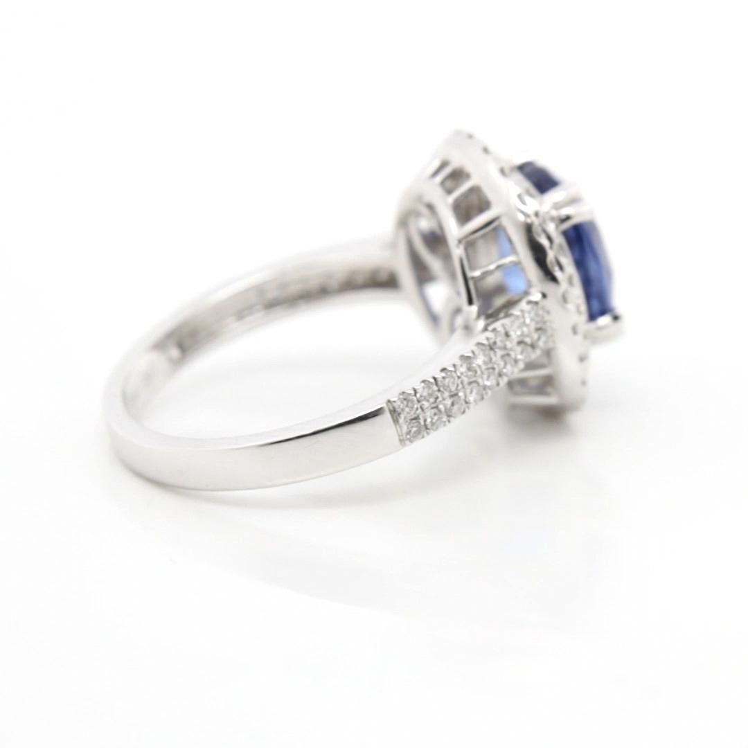 Oval Cut 3.21 Carat Blue Sapphire Double Halo Diamond Ring in 18K White Gold For Sale