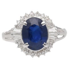 3.21 Carat Oval Cut Blue Sapphire and Diamond in Platinum Ring
