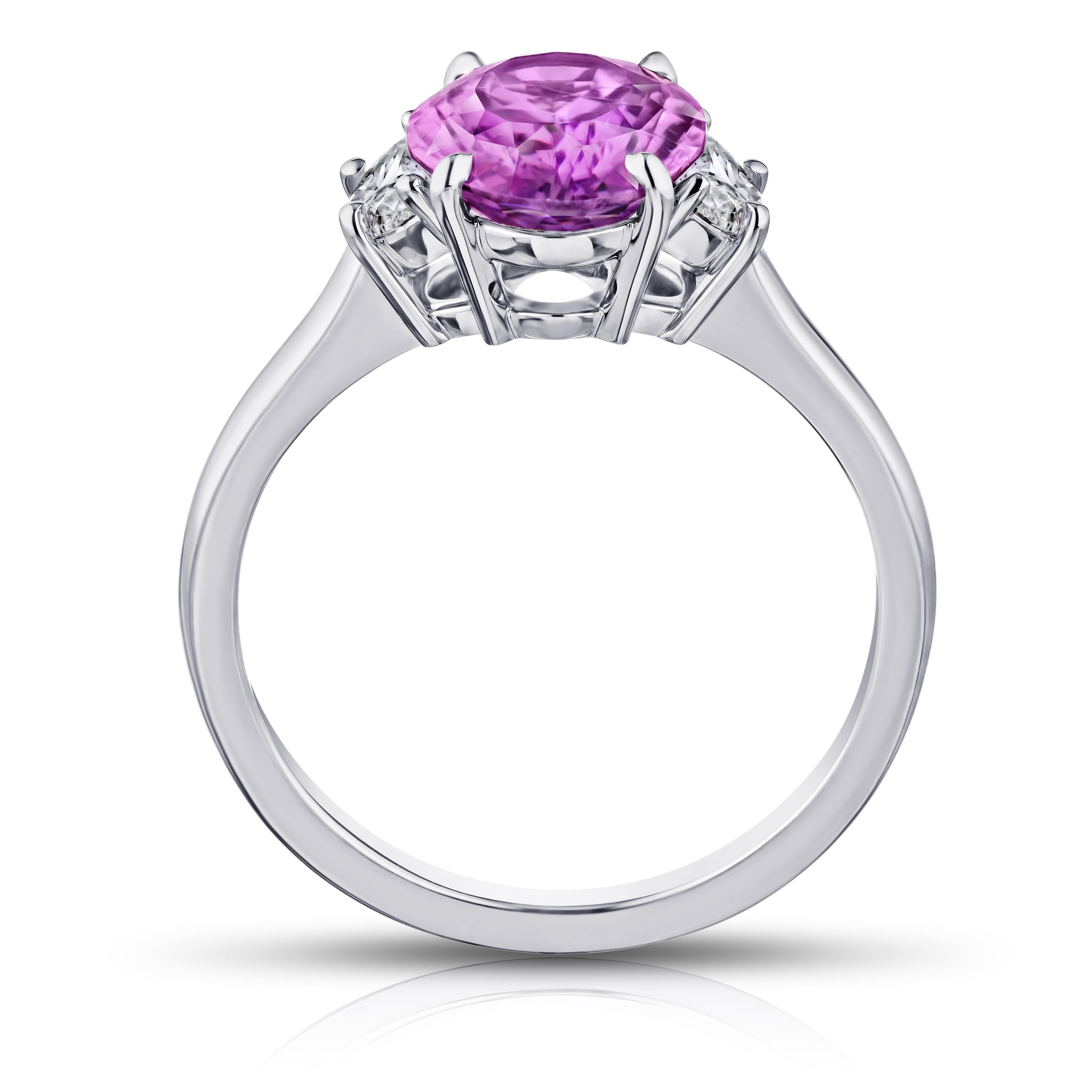 3.21 carat oval pink sapphire with half moon diamonds .36 carats set in a platinum ring. Ring is currently a size 7. Resizing to your finger size is included.
