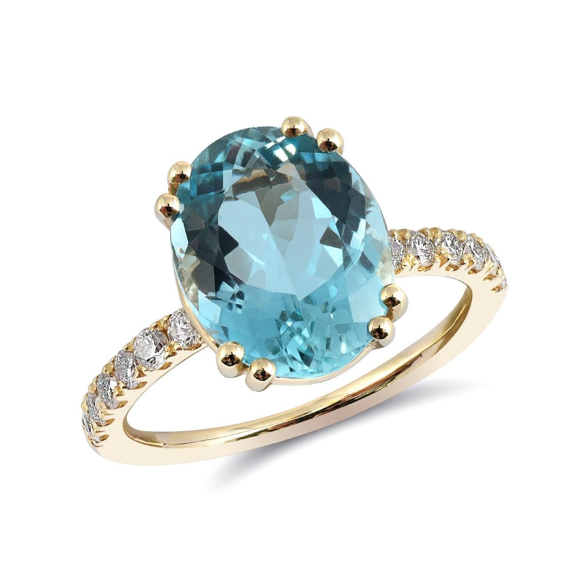 This delicately handcrafted ring features a 3.21 carat aquamarine set in a 14K yellow gold setting. The aquamarine, with its soft and captivating color, comes to life in this elegant design. The gem is centrally set and is flanked by diamonds,