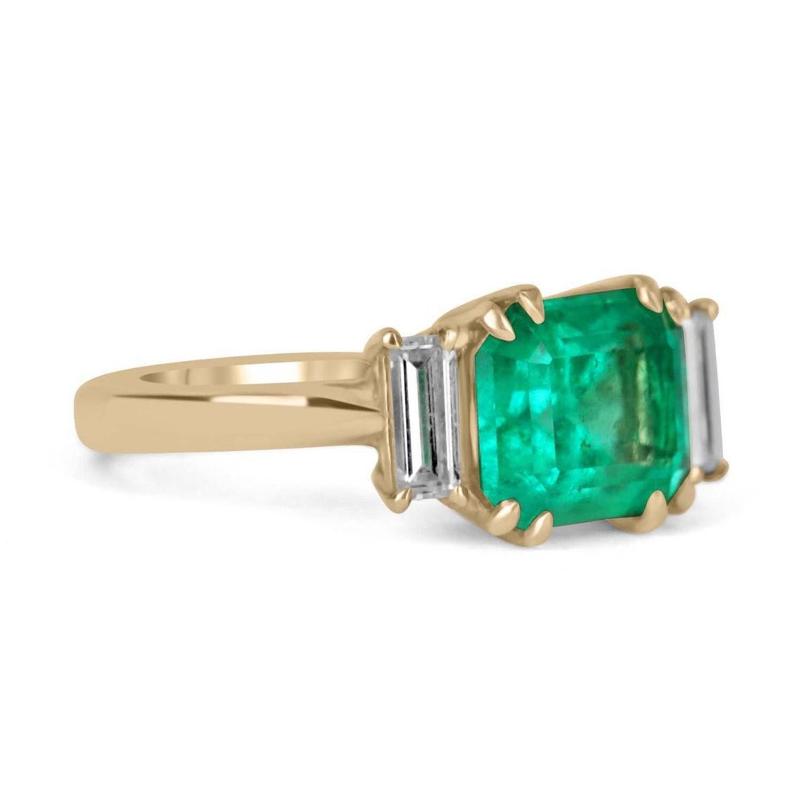 Featured is a magnificent, Colombian emerald and diamond ring. In the very center is a gorgeous, 2.85-carat Colombian emerald-emerald cut, set east to west and displays a stunning, vivid green color, and excellent luster. Accented on the sides, are