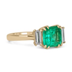 3.21tcw 18K Three Stone Emerald-Emerald Cut & Diamond Baguette Ring
