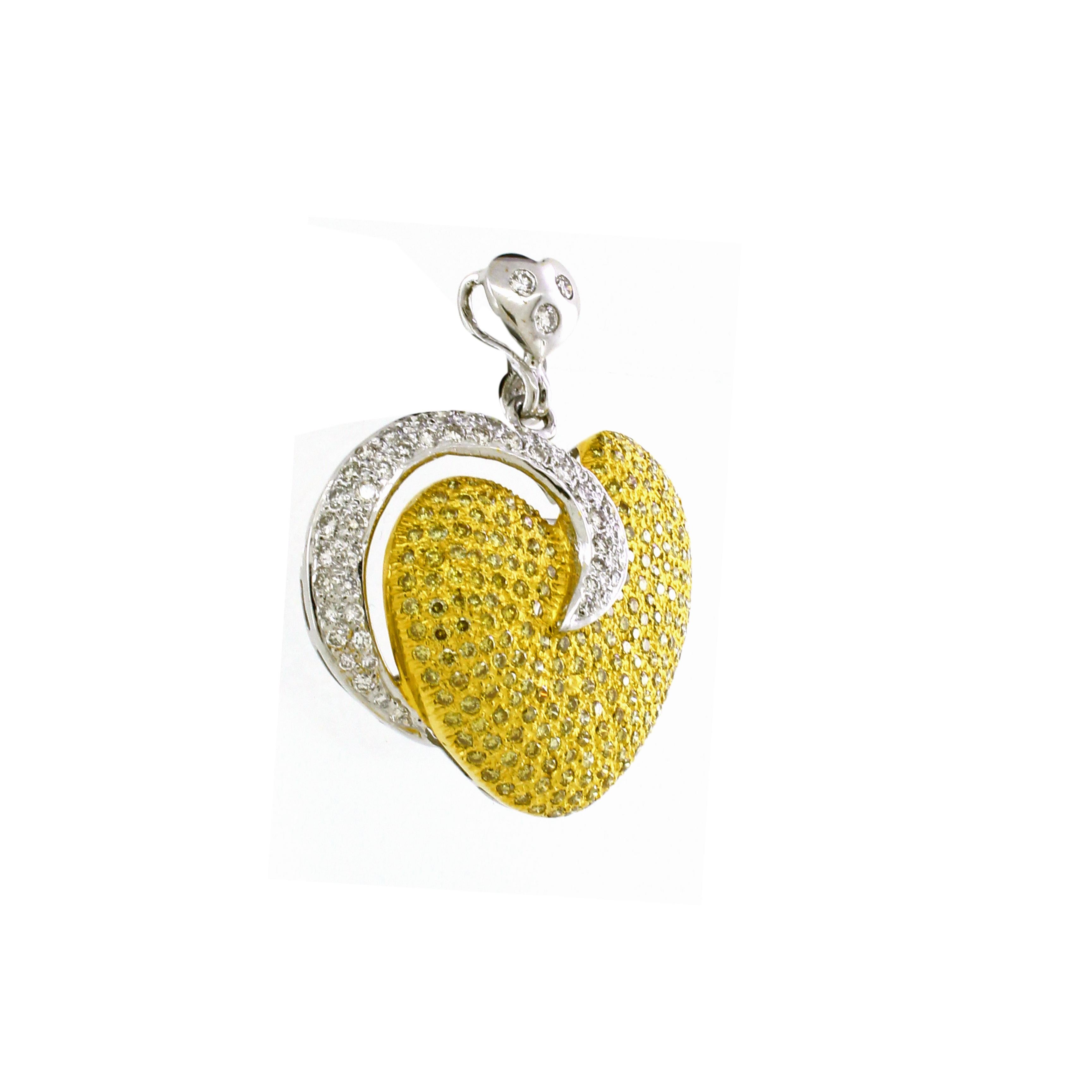Radiating love and timeless elegance, this heart-shaped pendant is a breathtaking symbol of sophistication and beauty. Crafted with meticulous attention to detail, the pendant is fashioned from a harmonious blend of 18K yellow and white gold,