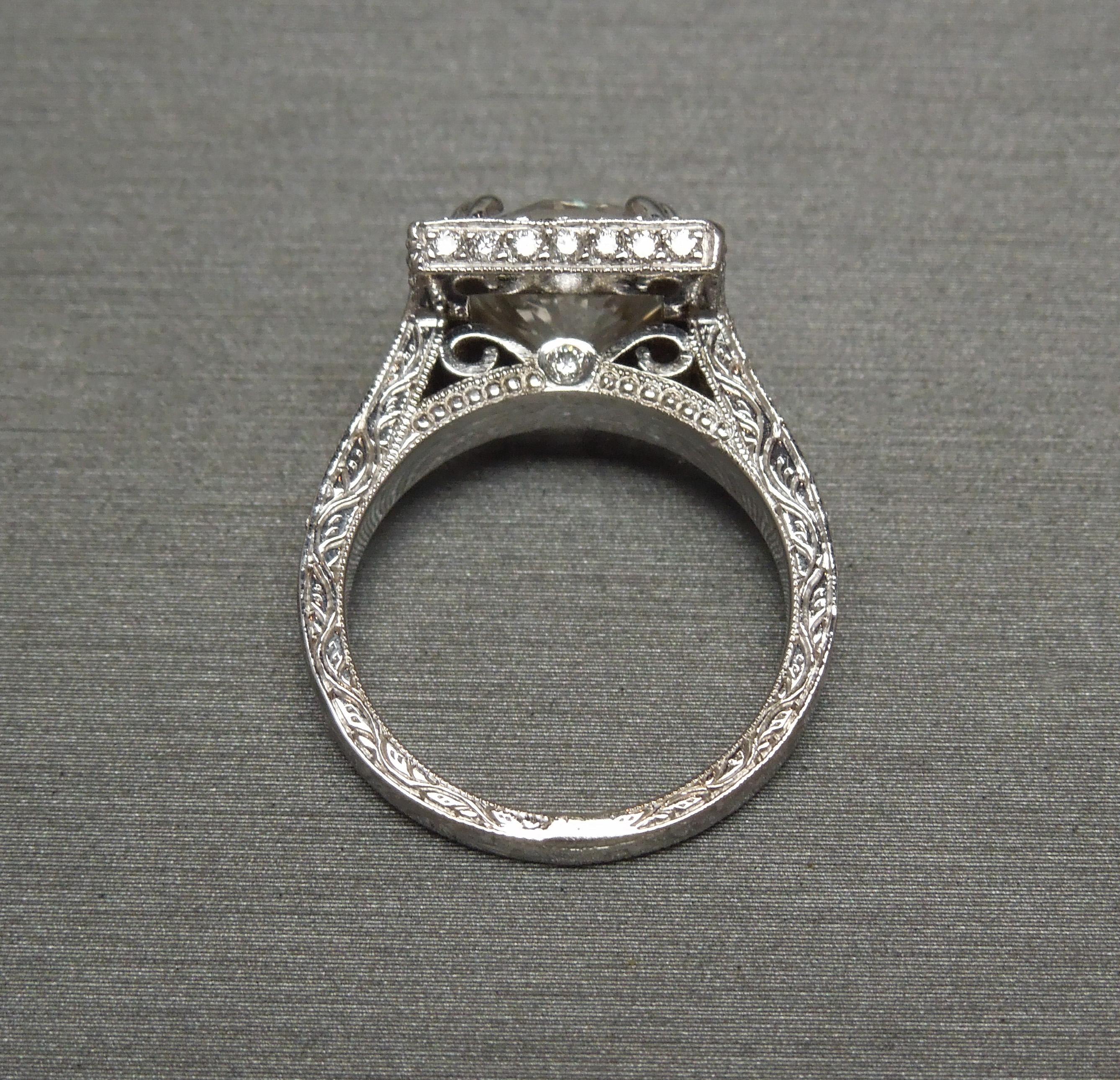 round diamond in square setting engagement rings