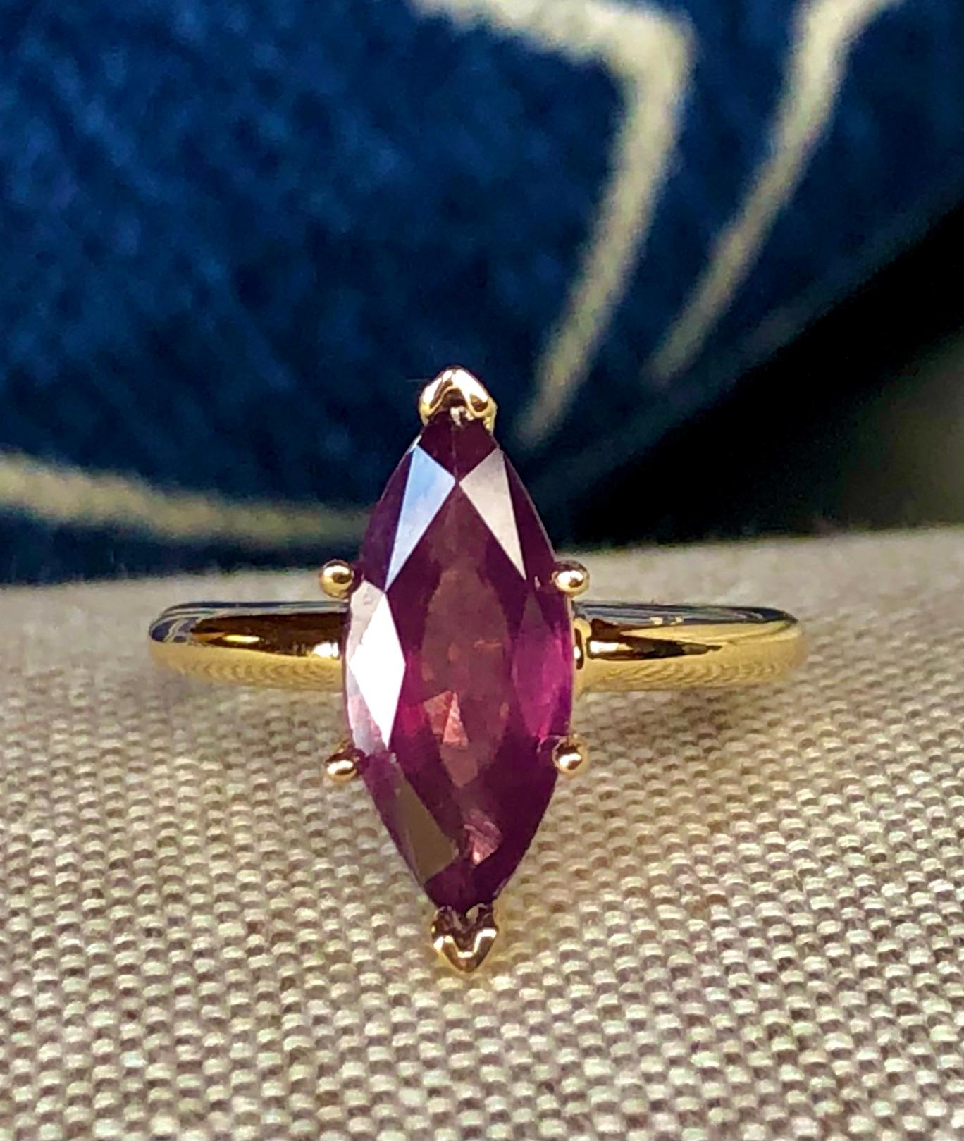 Fine Natural Marquise Spinel Solitaire Gold Ring. It is made of 14K yellow gold and is in Brand New Condition. It has a  3.22-carat purple-pinkish spinel untreated 100% natural. The fine spinel has very good clarity and color. This beautiful piece