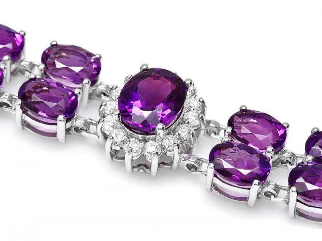 32.20 Natural Amethyst and Diamond 14K Solid White Gold Bracelet

Total Natural Amethyst Weight is: Approx. 30.90 carats 

Amethyst Measure: Approx. 9x7 mm (3) 

Amethyst Measure: Approx. 7x5 mm (32) 

Total Natural Round Diamonds Weight: Approx.