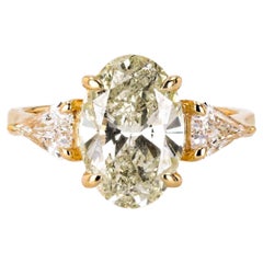 3.23 Carat Champagne Oval Three Stone Ring