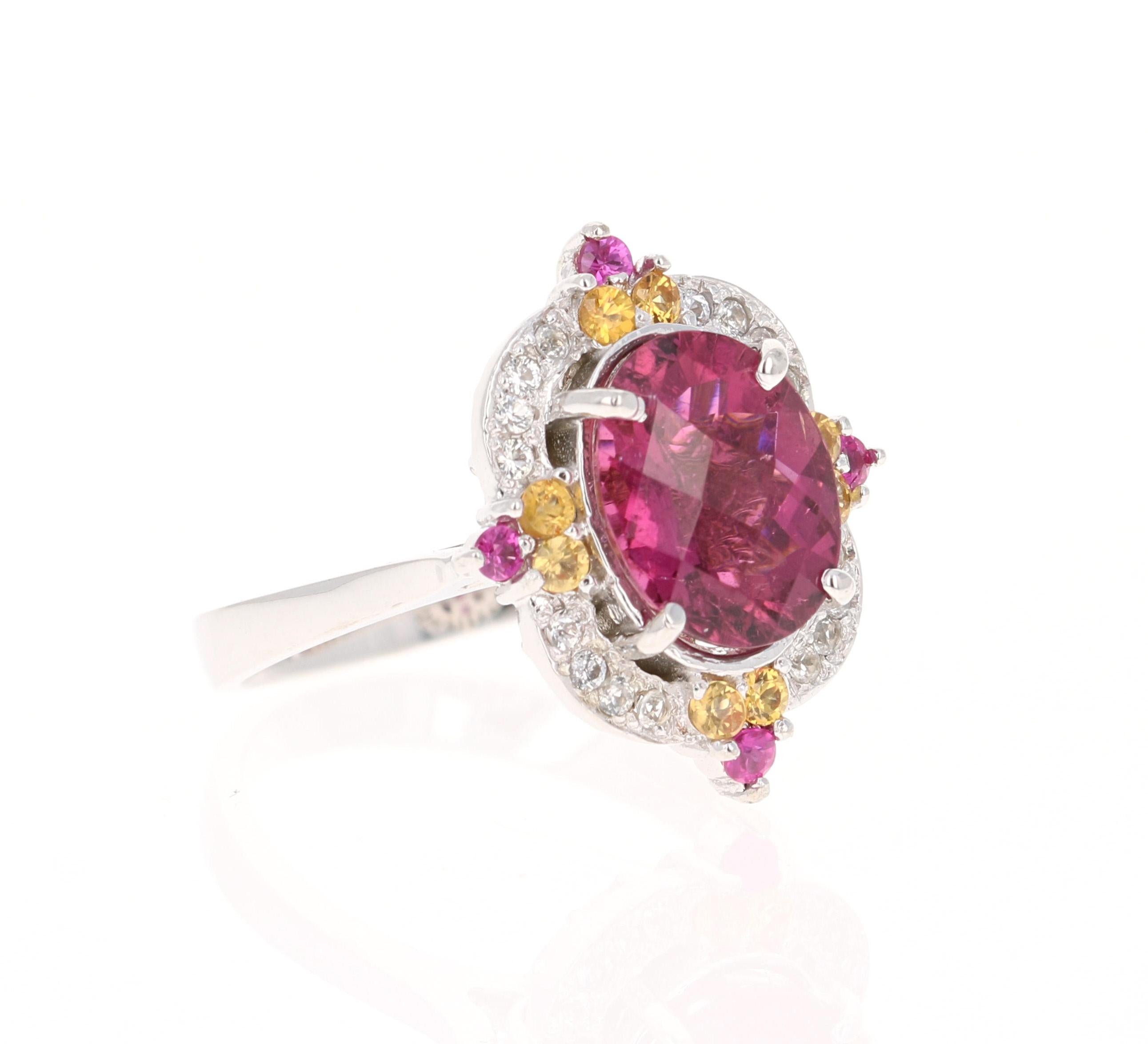 3.23 Carat Tourmaline Sapphire White Gold Cocktail Ring

This ring has a 2.68 carat Tourmaline that is set in the center of the ring and is surrounded by 12 Yellow and Pink Sapphires that weigh 0.37 carats and 16 White Sapphires that weigh 0.18