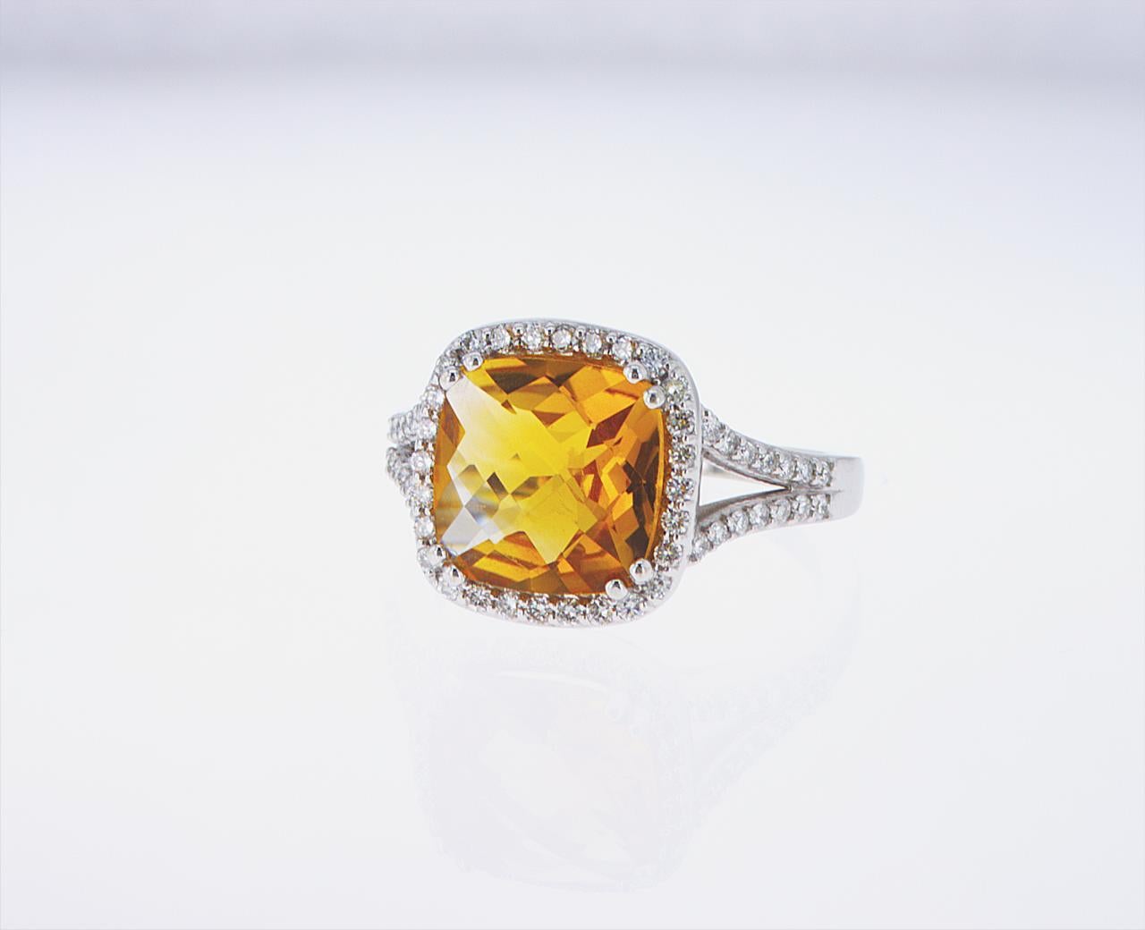 3.23ct Cushion Cut Citrine center set in a 14k White Gold mounting with 0.40ct total weight of accent diamonds.