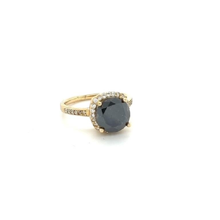 This ring has a Natural Black Round Cut Diamond that weighs 2.87 carats and measures at approximately 9 mm. It also has Natural Round Cut White Diamonds that weigh 0.37 carats and has a clarity and color of VS-H. 

The total carat weight of the ring
