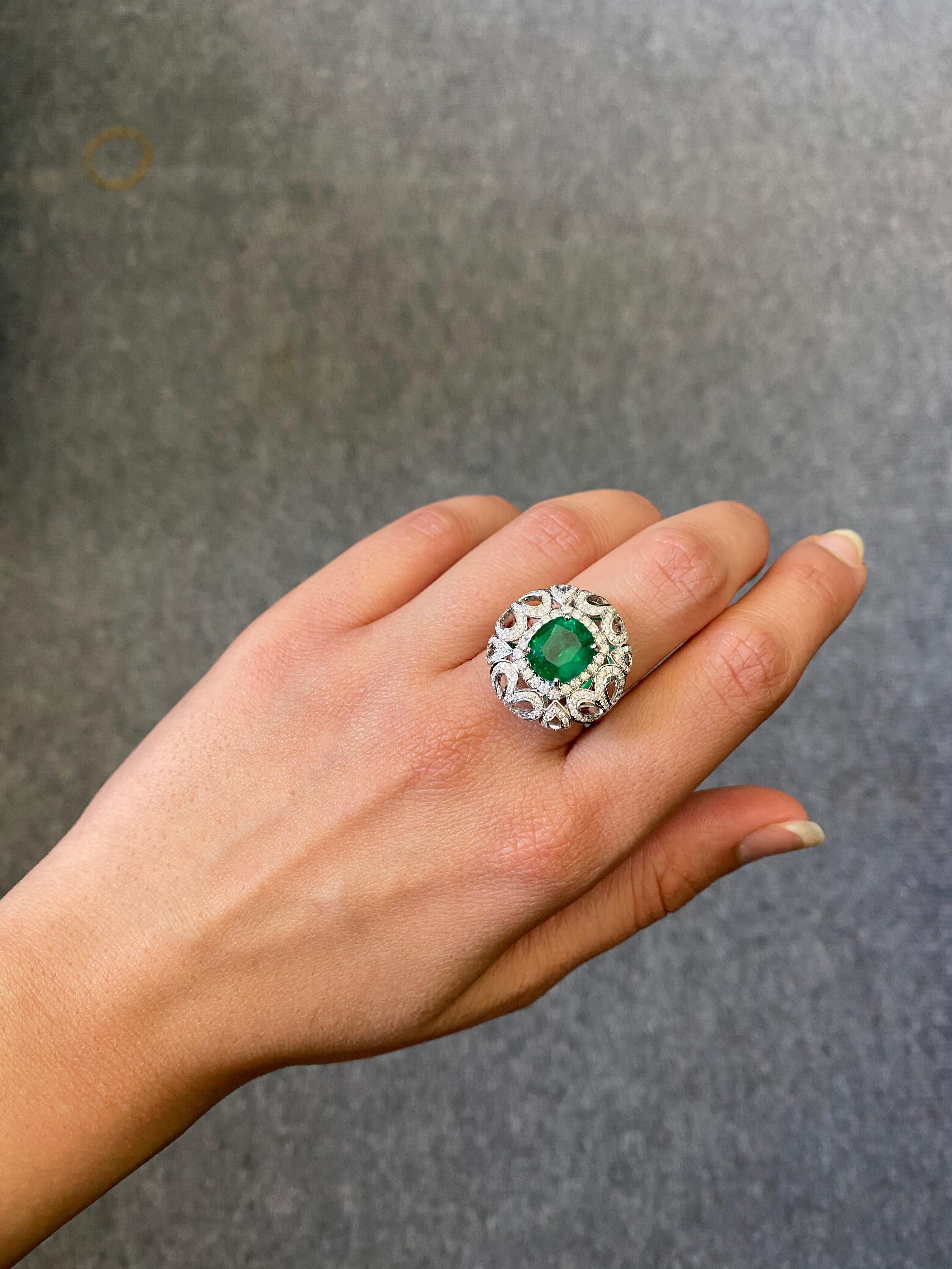 A unique 3.24 carat Zambian Emerald Ring with Diamonds, all set in 18K white gold. The stone is transparent, without any treatment/dye, very few visibile natural inclusions. The pictures depict the actual colour/quality of the centre stone.