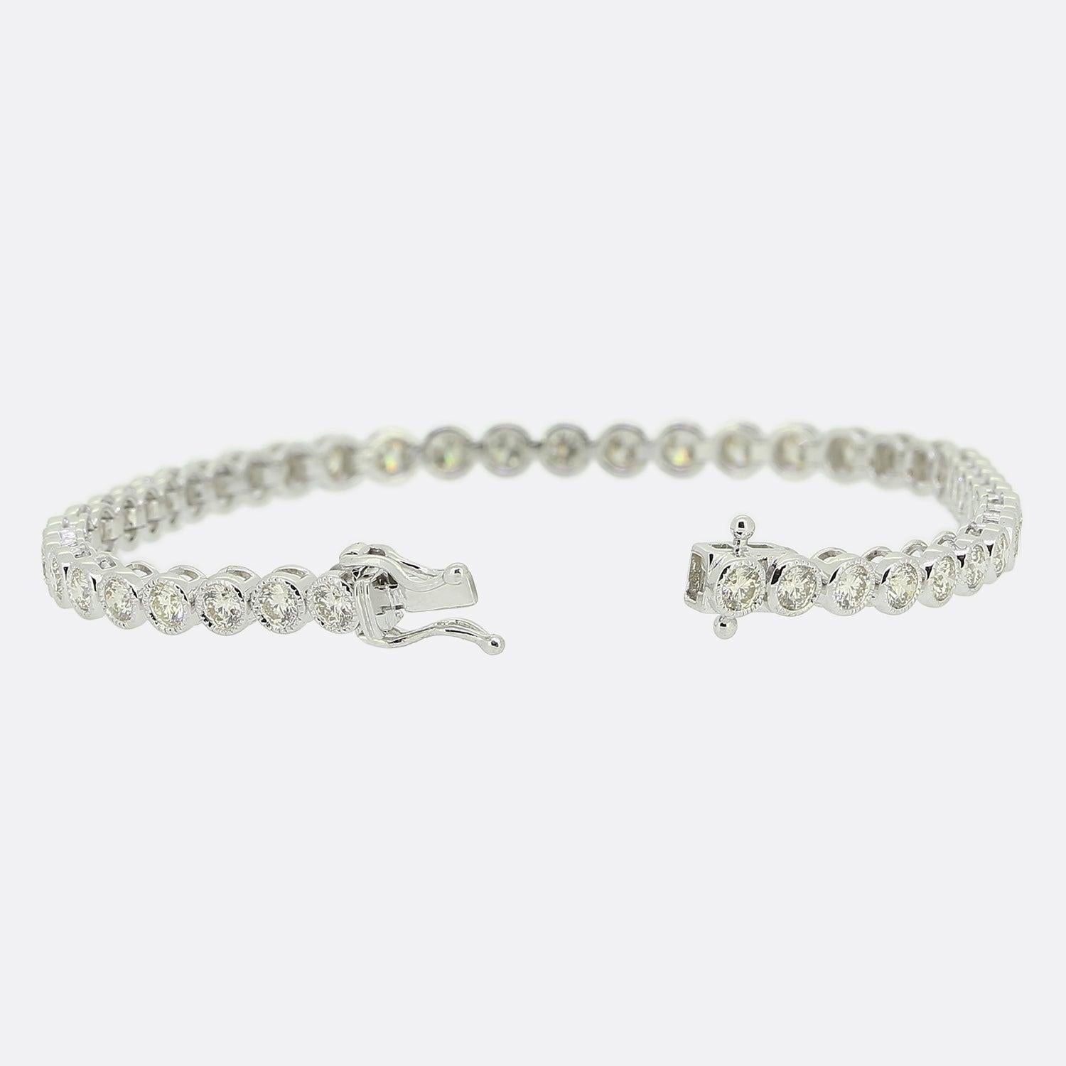 Here we have a classic diamond line bracelet totalling 3.24ct. This elegant piece has been crafted from 18ct white gold and showcases 45 round brilliant cut diamonds; all of which have been individually milgrain set in a single line formation and