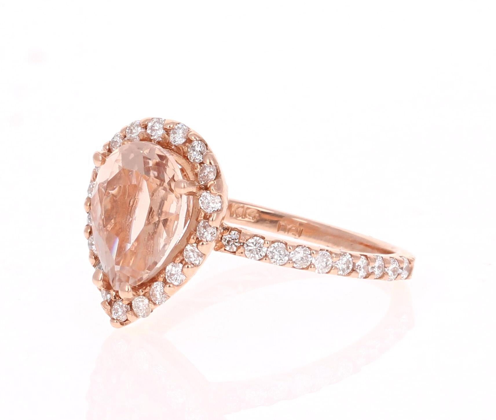 This gorgeous and classy Morganite Ring has a 2.61 Carat Pear Cut Morganite as its center and is surrounded by a halo of 39 Round Cut Diamonds that weigh 0.63 carats. The clarity and color of the diamonds are SI-F.   The total carat weight of the