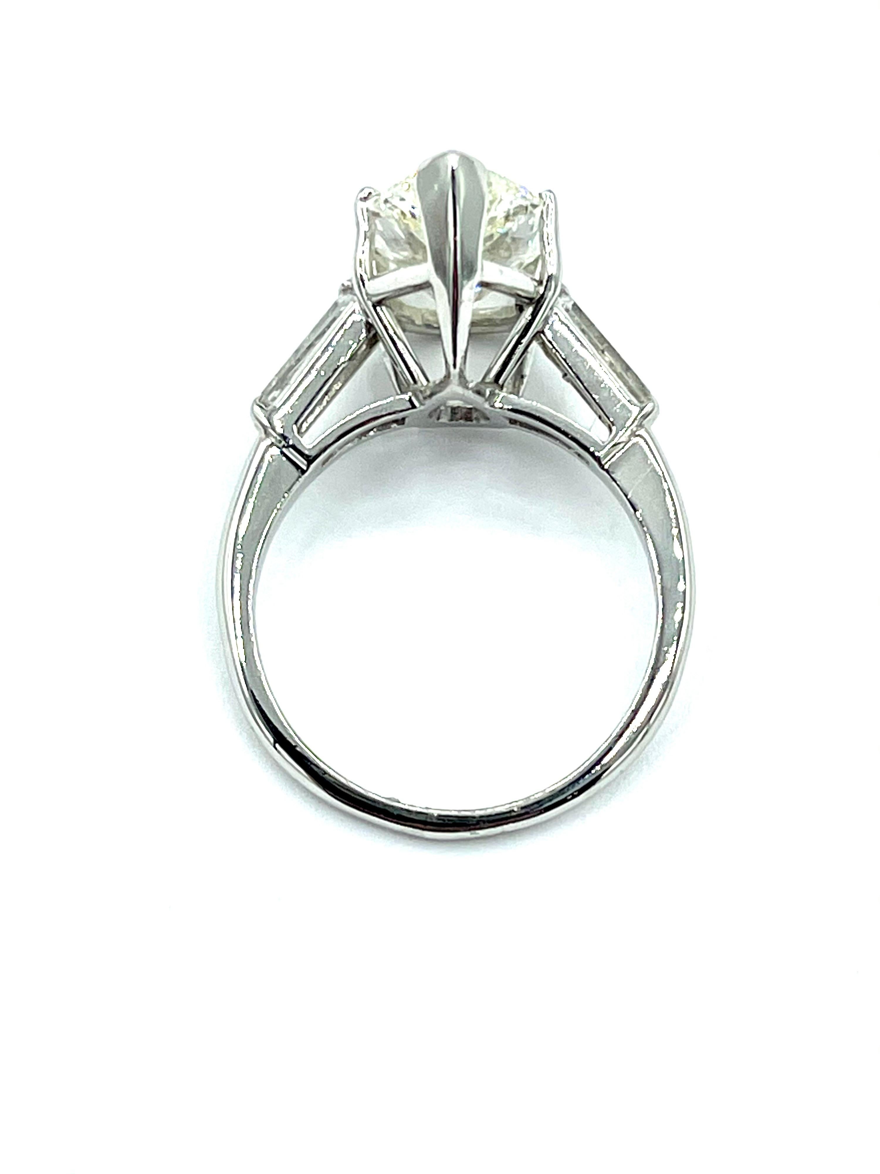 Modern 3.24 Carat Pear Shape Diamond and Tapered Baguette Diamond Platinum Ring