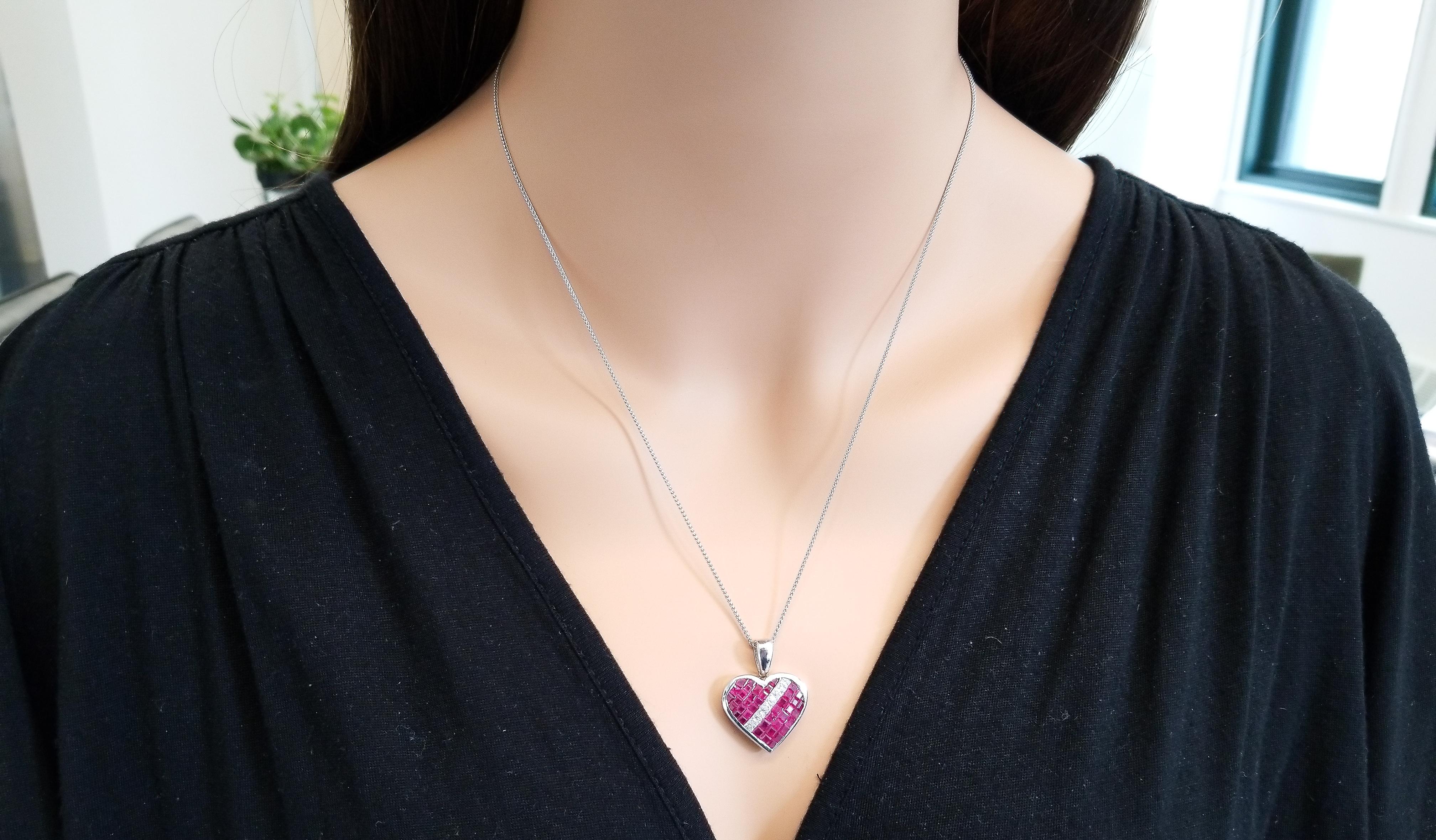 When you present this gorgeous ruby and diamond heart pendant to your favorite lady, she will be completely thrilled! This heart pendant includes 3.24 carat total of juicy red princess cut Thai rubies, with a diagonal row of 0.46 carat total