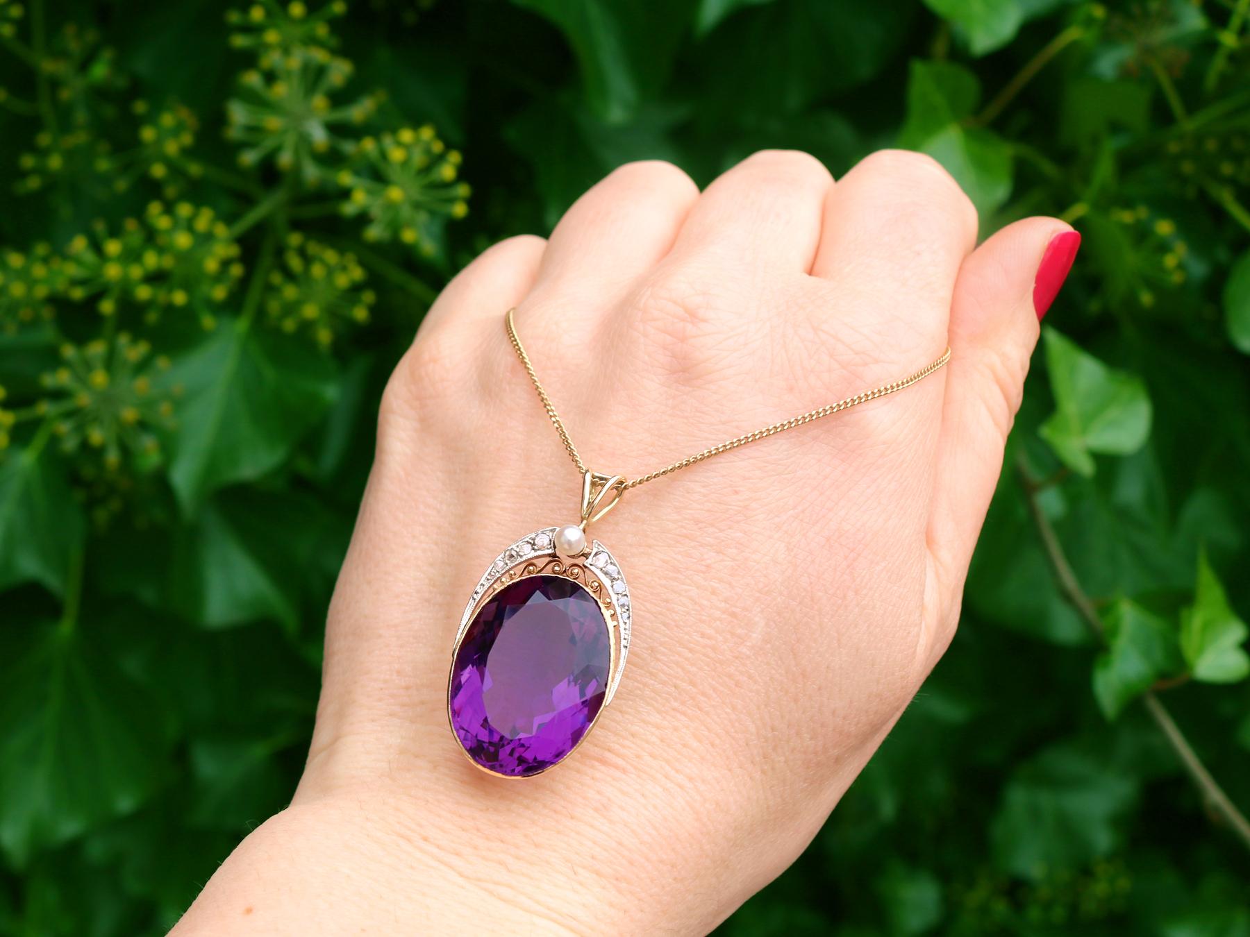 A stunning, fine and impressive 32.42 carat amethyst, 0.25 carat diamond and cultured pearl, 14k yellow gold and platinum pendant; part of our diverse vintage jewelry collections

This stunning, fine and impressive oval faceted amethyst pendant has