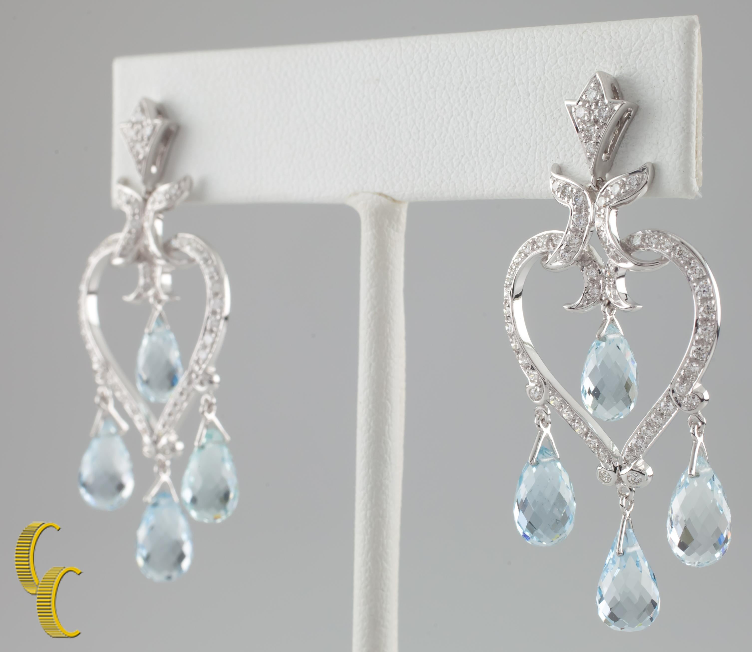 18k White Gold Open Heart Earrings Attached to posts.
Heart is encrusted with pave diamonds, and features four hanging briolette aquamarines
Aquamarine Total Weight: Approximately 2.00 Carats
Diamonds Total Weight: Approximately 1.25