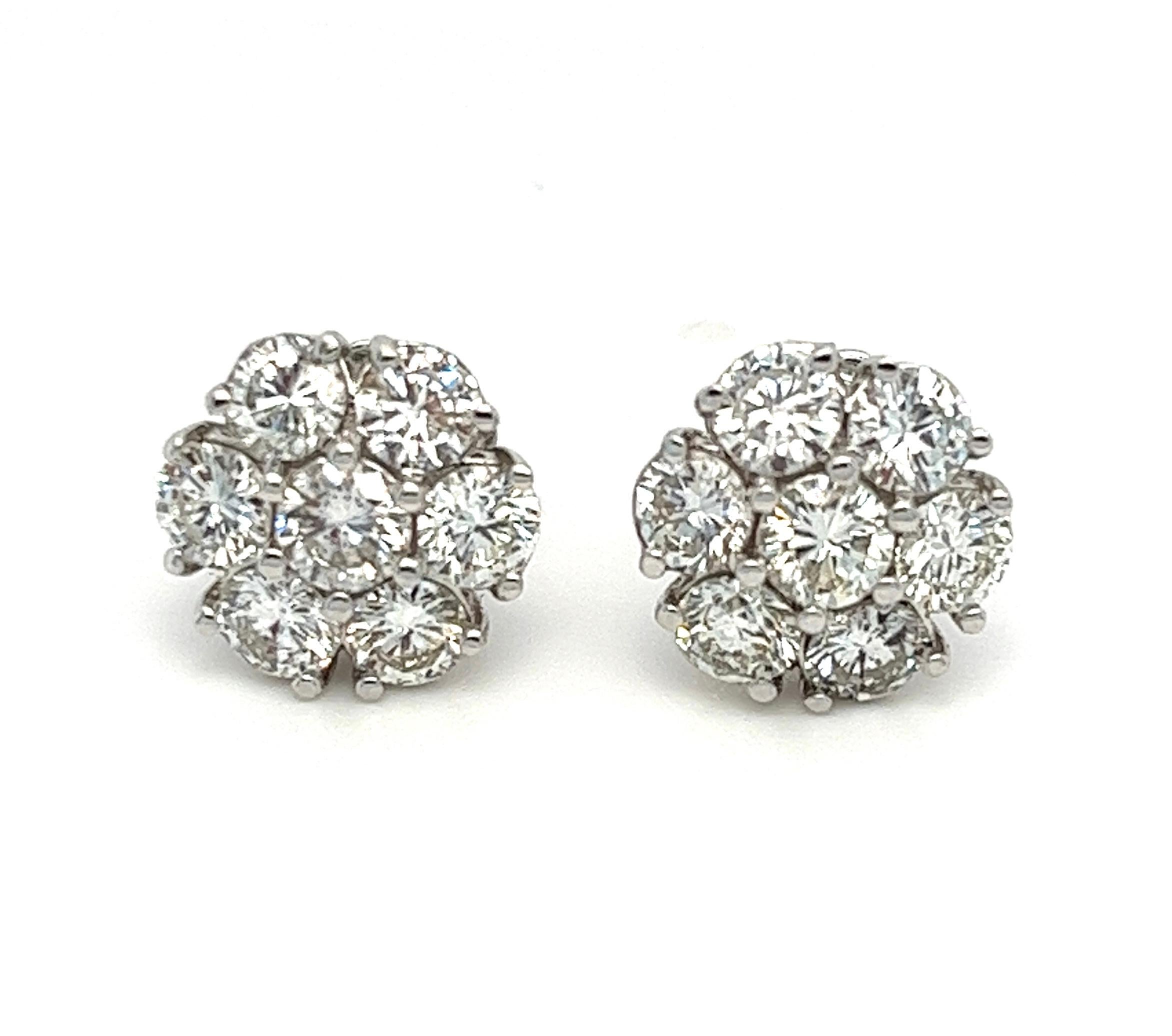 Offered here is a stud earring, shaped in a bouquet of flower with 7 diamonds in each ear, a total of 14 natural earth mined diamonds weighing approximately 3.25 carats total, sparkly bright white averaging H-I in color and SI1 in clarity.
Stud is