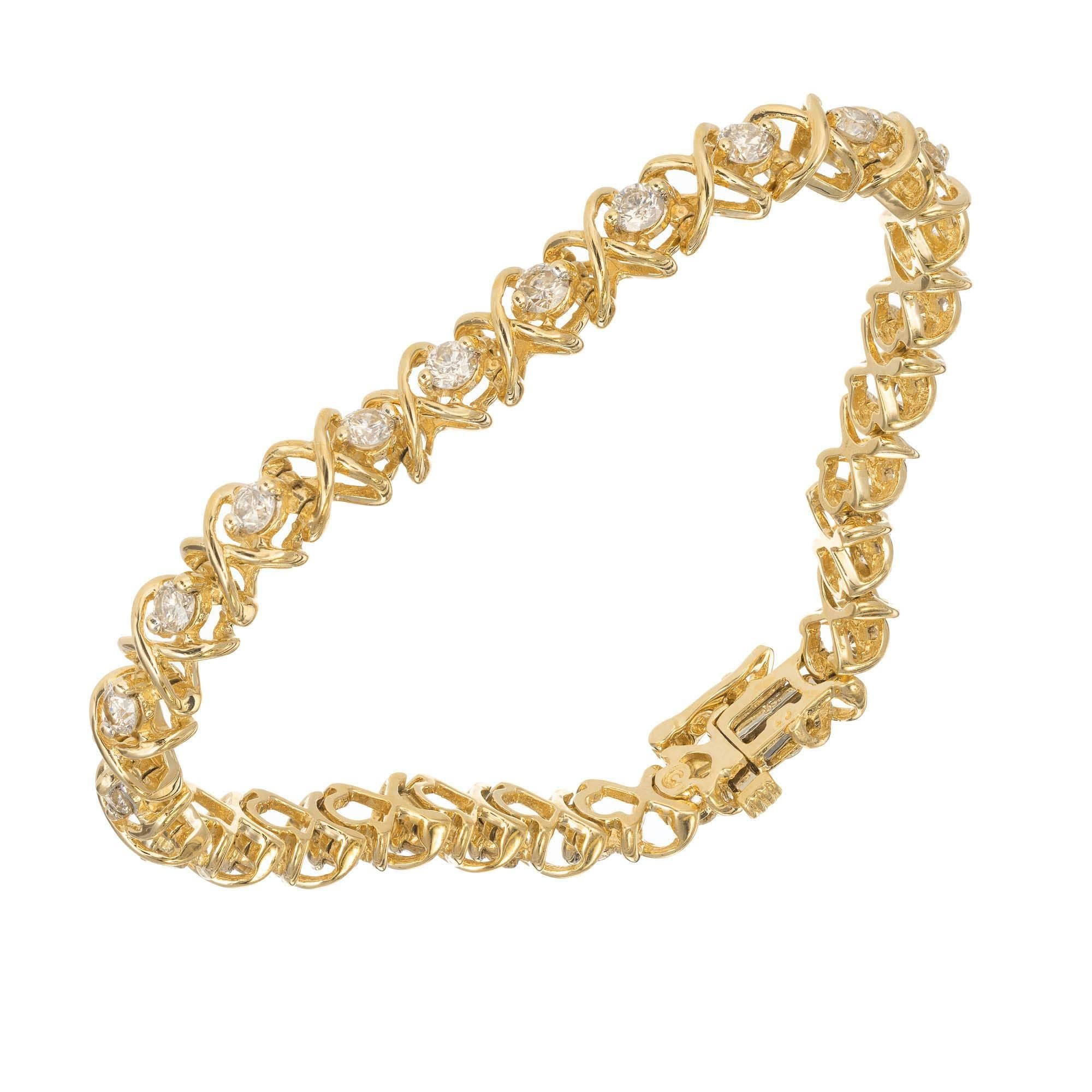 14k yellow gold and diamond tennis bracelet round brilliant cut diamonds are set alternating open X wires to appear as X’s and O’s

25 round I-J VS-SI diamonds 2.83-3.5mm Approximate 3.25 total weight
14k Yellow Gold
Tested: 14k
Stamped: