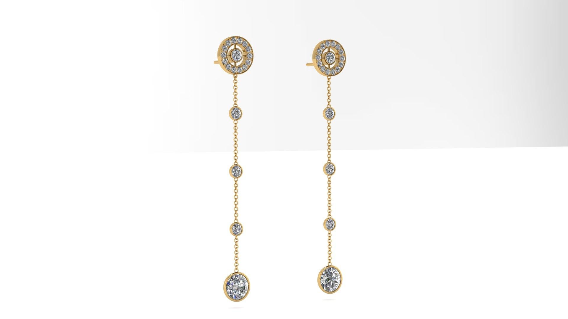 3.25 carats Diamonds dangling earrings made in 18k Yellow gold.
The length of the earrings is 66 mm, the bottom two dangling roung diamonds, are 1 carat each, H color, VS1-VS2 clarity.
The middle and top diamonds' total carat weight is approximately