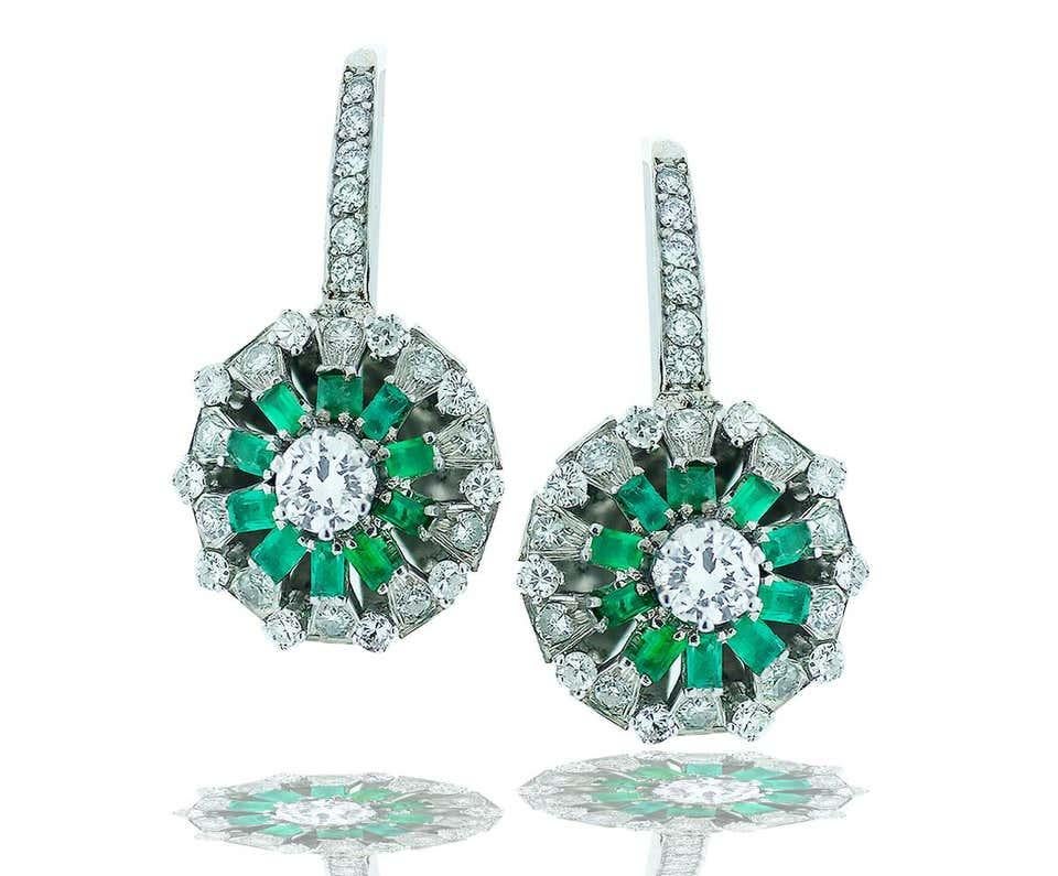 
 Beautiful Emerald Diamond, 2.50 Carat Earrings
Emerald and Diamond Quality Earrings vintage 1960's modern era.
 Consisting of 20 green emeralds which are baguette shaped they are of exceptional and matched as vibrant color. 
The stones are VS