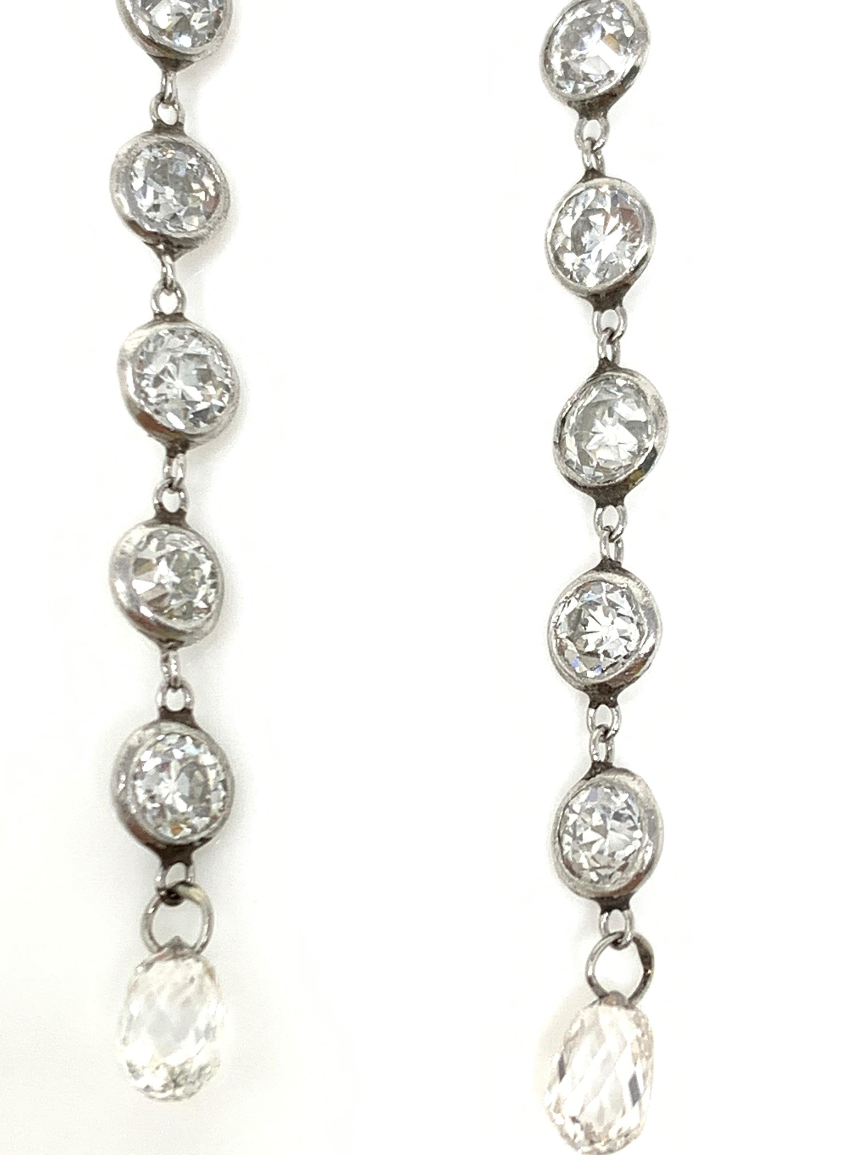 Moguldiam Inc's bezel set diamond long earrings are beautifully custom hand made in Platinum. 
The details are as follows : 
 Diamond weight : 3.25 carat 
 Metal : Platinum 
Measurements : 2 1/2 inches long 






