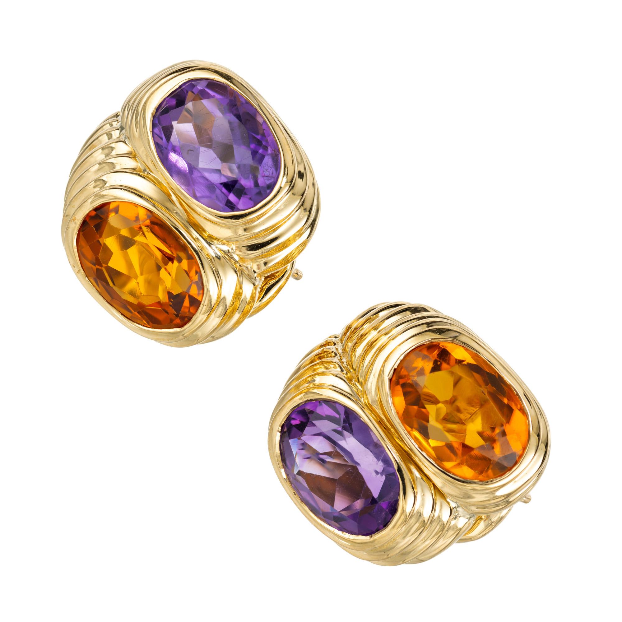 1960's Mid Century Amethyst and Citrine lever back earrings. Each 18k yellow gold setting is adorned with 2 oval purple amethysts totaling 3.25 and accompanied with 2 oval yellow and orange citrines also totaling 3.25cts. These earrings have secure