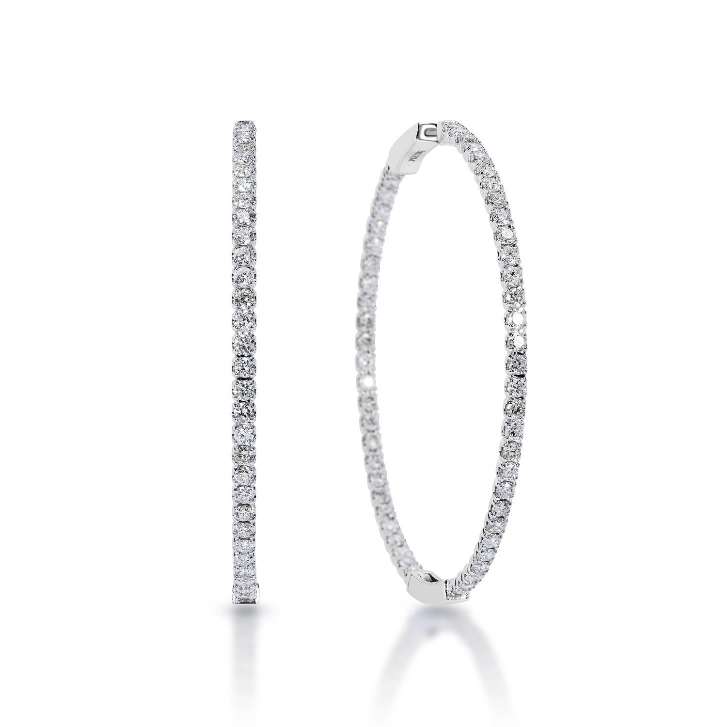 Diamond Hoop Earrings:
Circle Hoop earrings one row of diamonds inside and outside.  diameter is a little bit under 2 inches


Carat Weight: 3.27 Carats , (110 diamonds)
Shape: Round Brilliant Cut
Metal: 14 Karat in White Gold 9.05 grams 
Style: