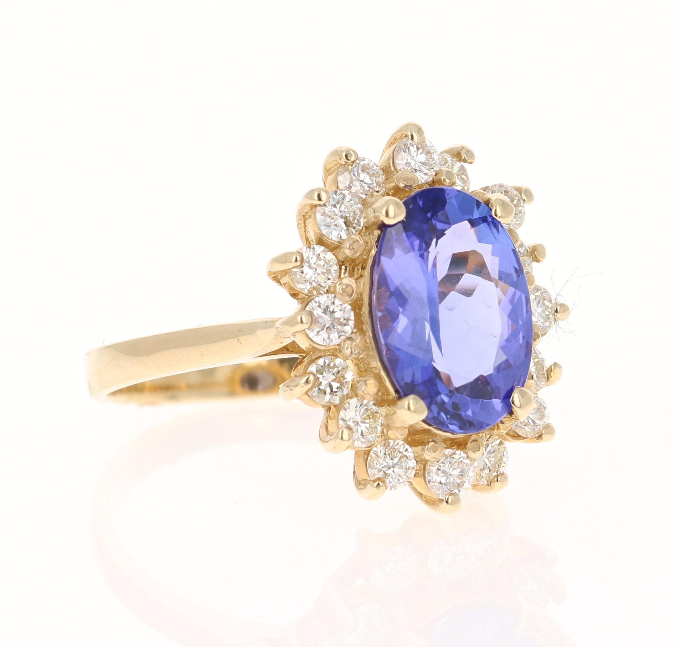 This beautiful ring has a vivid 2.53 Carat Oval Cut Tanzanite. The Tanzanite is surrounded by 16 Round Cut Diamonds that weigh 0.72 carats. (Clarity: SI1, Color: H) The total carat weight of the ring is 3.25 carats. The Oval Cut Tanzanite measures