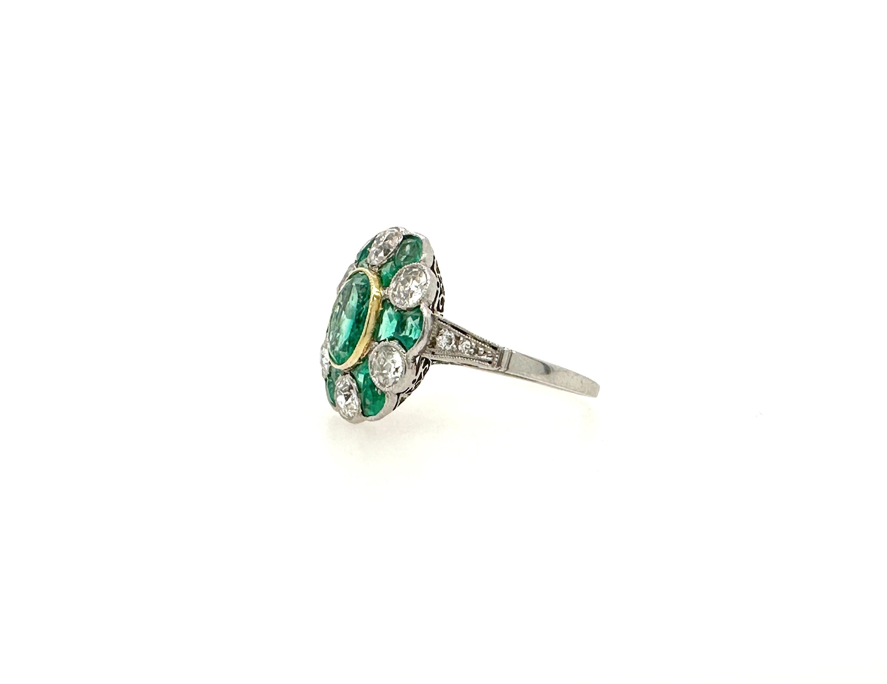 This Victorian era Colombian halo ring is a one of a kind piece of art.
Made of approximately 1 carat oval emerald and 1 carat mixed cut emerald halo along with approximately 1.25 carat total old mine cut diamonds halo it is a definite head