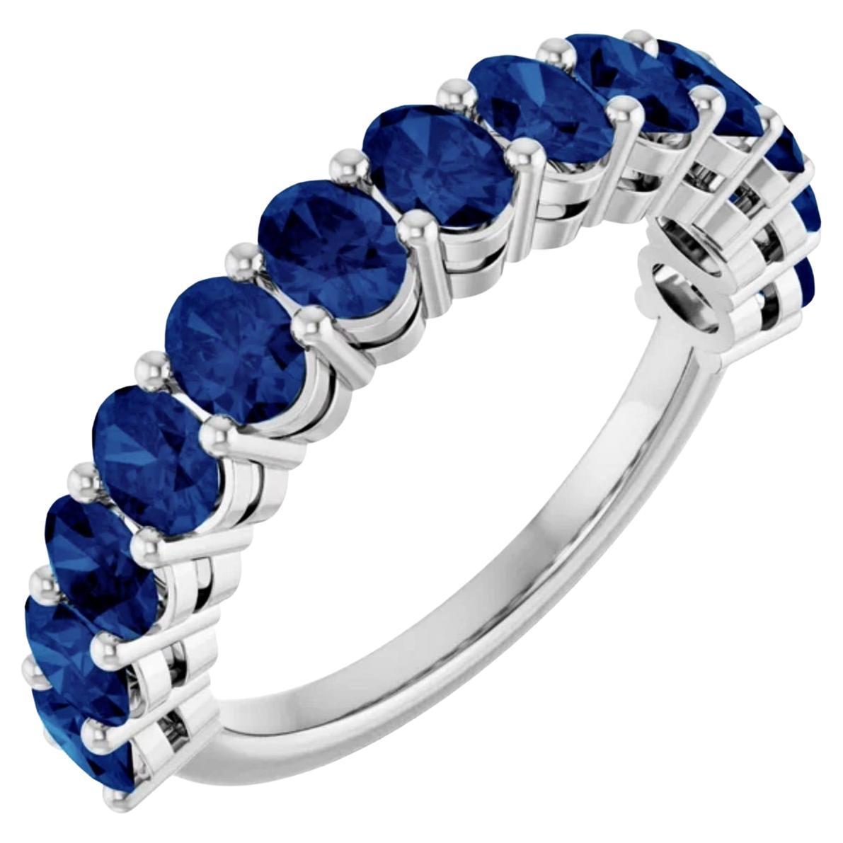 A timeless elegant vibrant blue oval-cut natural sapphire, thirteen-stone eternity band ring. Weighing 3.25 carats, set in a very classic thirteen-stone platinum mounting. top band is 4.10mm wide. The 12-13 oval-cut sapphires are full of color and