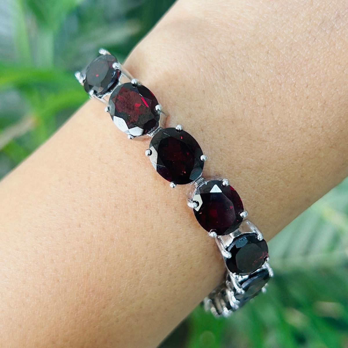 32.5 Carats Garnet Gemstone Tennis Bracelet in sterling silver showcases endlessly sparkling natural garnet, weighing 32.5 carat. It measures 7.25 inches long in length. 
Garnet stimulate concentration and reduces stress. 
Designed with perfect oval