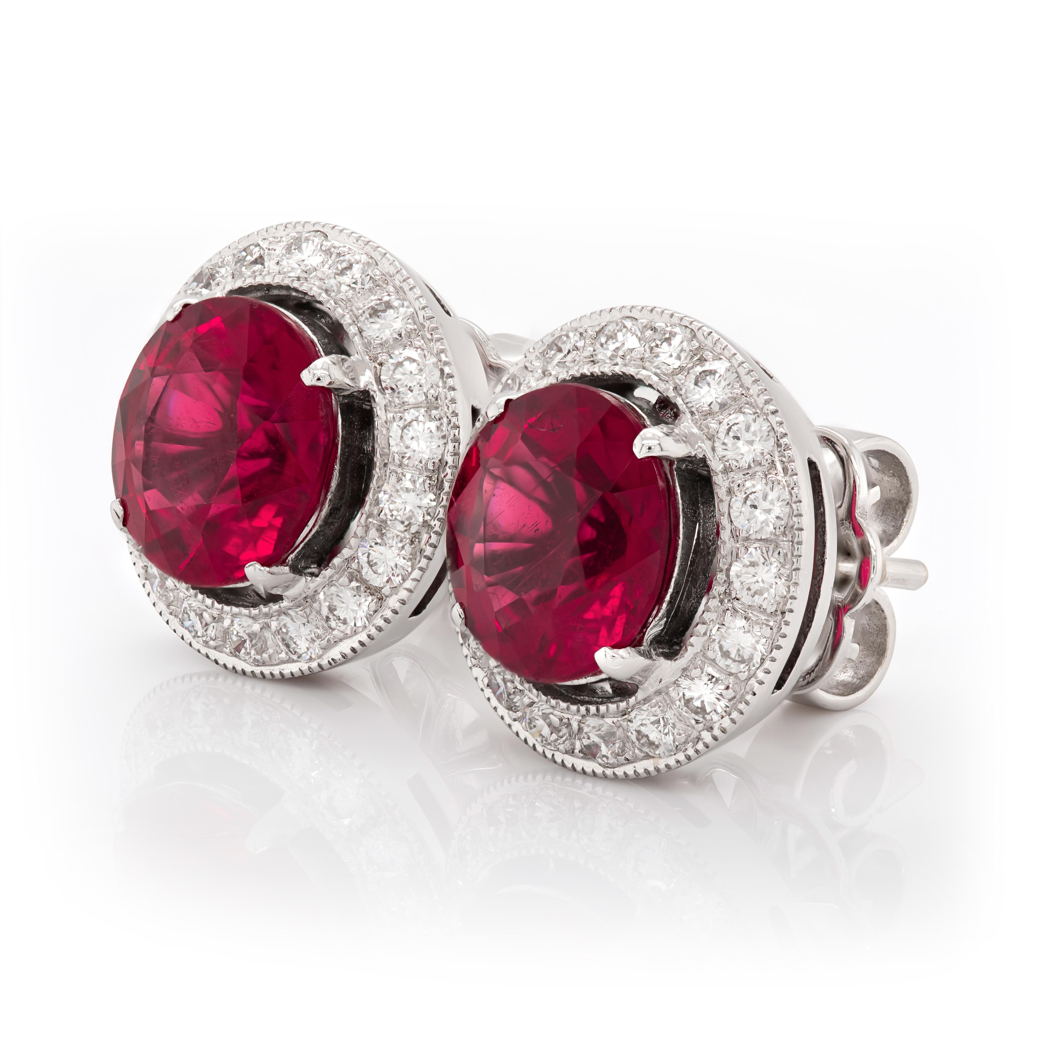 Set with perfectly matched 3.25 carats Rubellites, this pair of classic studs will add color to any outfit. Eye clean gems that have been cut to perfection to reveal an even fuchsia pink, adds grace to this pair. Set in 18K White Gold surrounded by