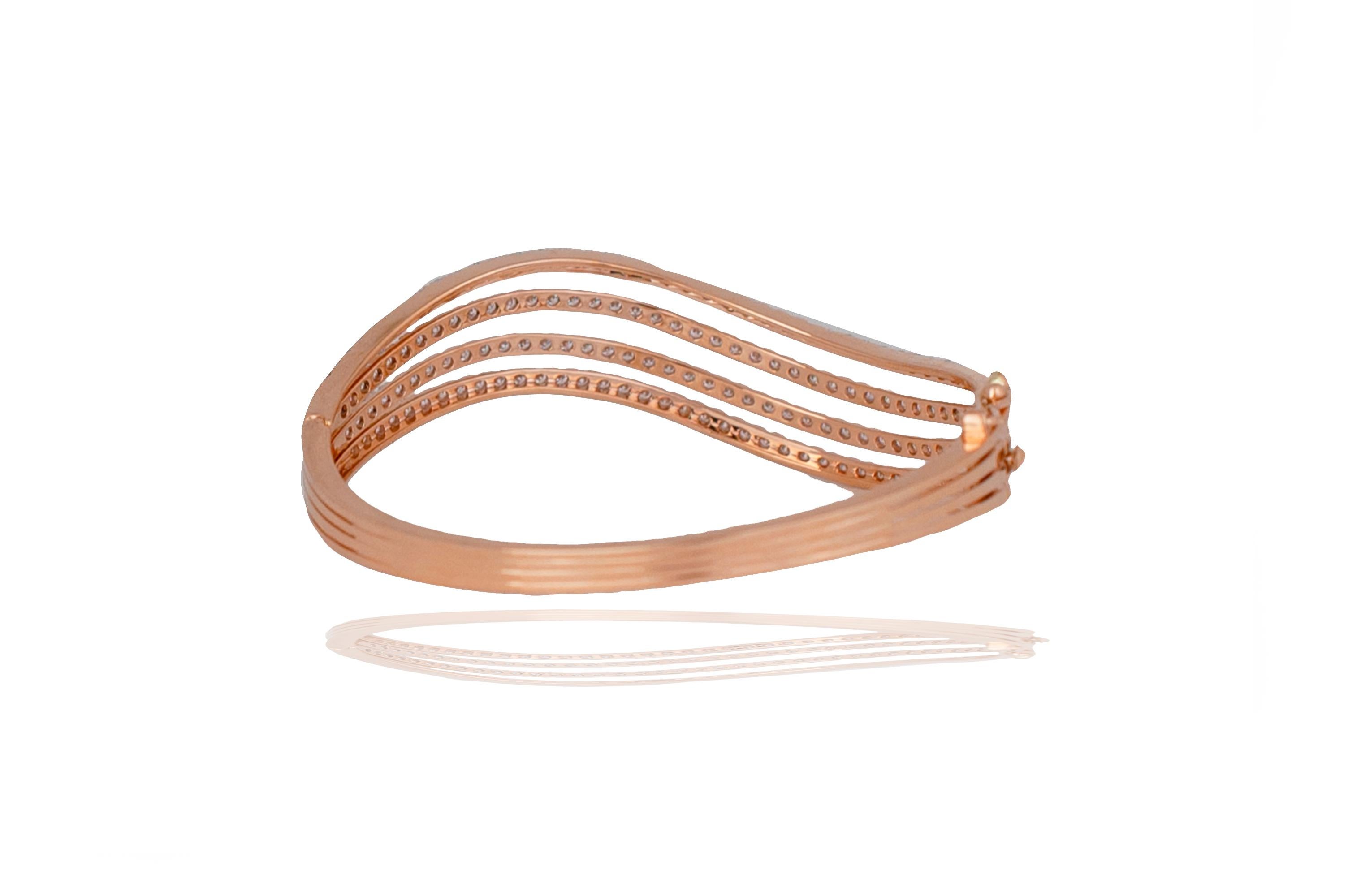 This modern rose gold diamond bracelet cuff has unique design to it but still finds a timeless look with its setting style.  This bracelet has three rows, each have 39 round brilliant diamonds that have a color and clarity of F-G VS-SI.  The