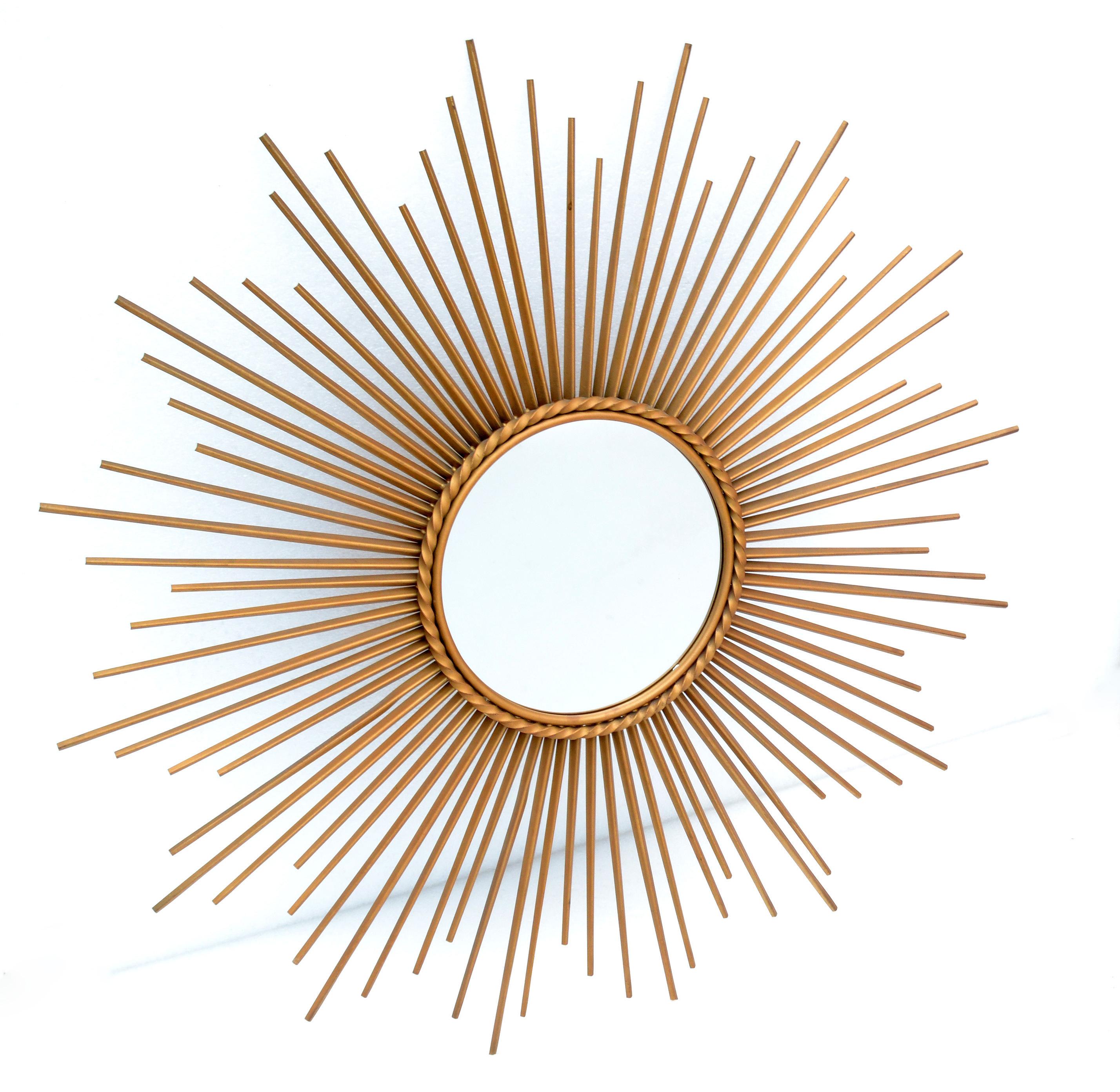 32.5 Inches Diameter brass sunburst mirror Miroir Sorciere with 9.25 inches flat central mirror.
Gold Finished Iron on a back board.
Made in France, circa 1950's.
Providence: Images in Magazine 